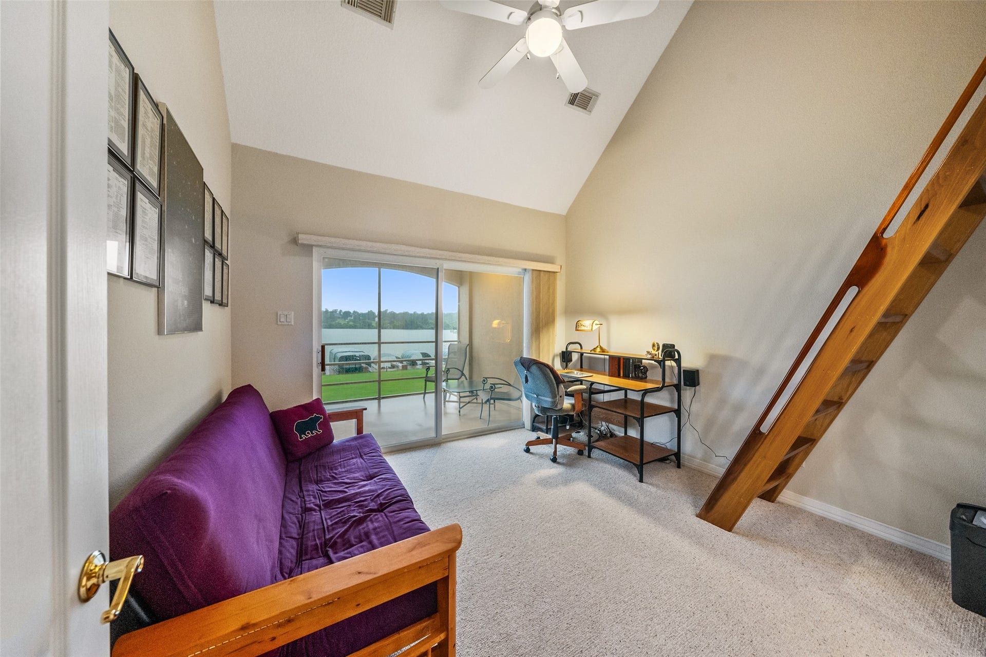 The smaller of the two secondary bedrooms has access to the second floor balcony.