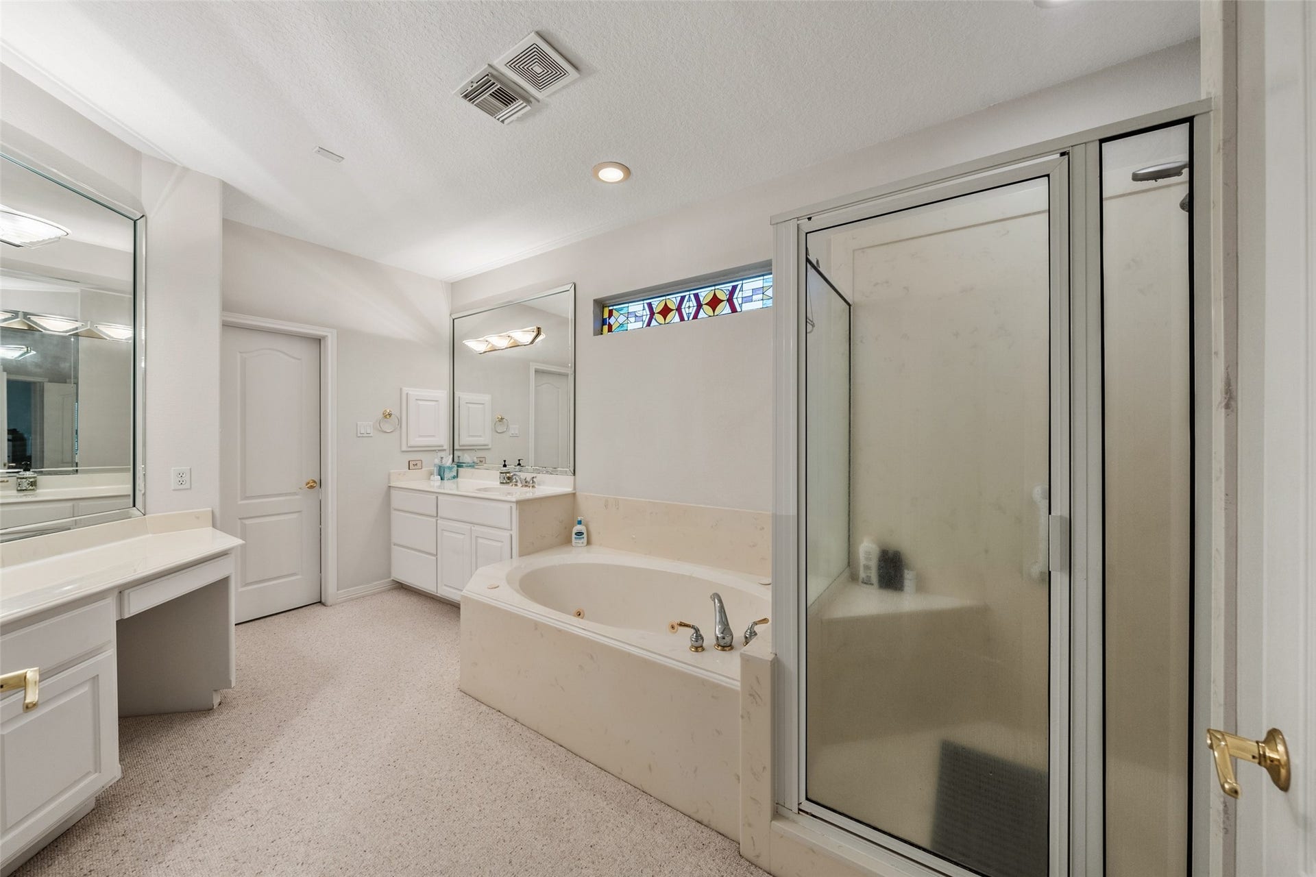 Busy mornings are a breeze with double sinks and a separate shower and jacuzzi tub