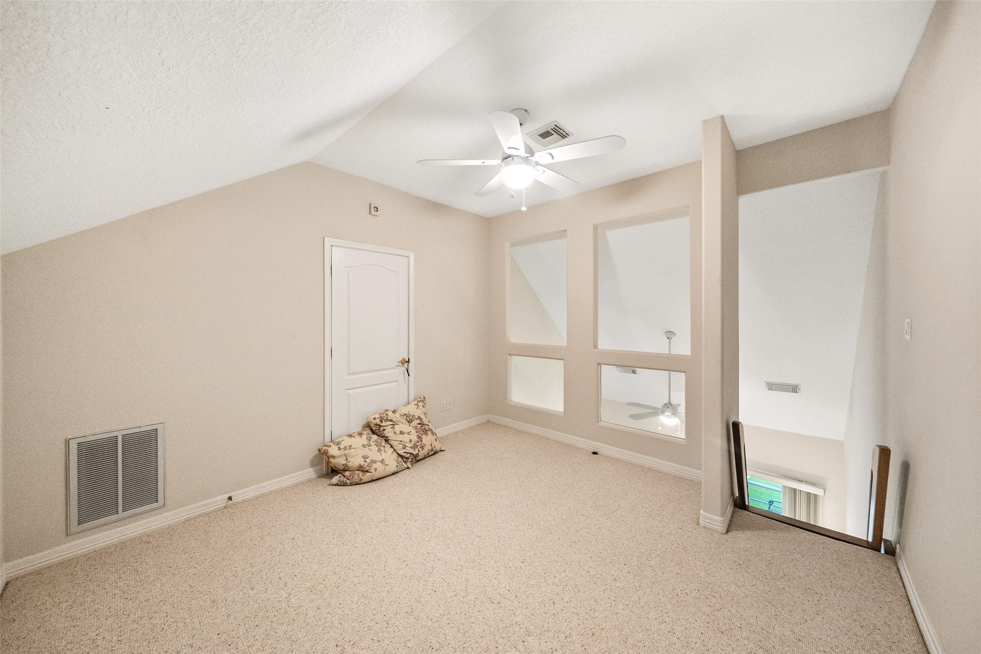 Loft tucked at the top of the staircase has so many uses---fourth bedroom, play area, or whatever you might need.