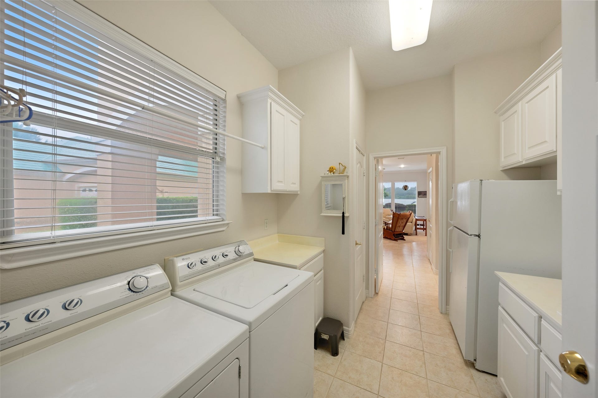 Add a second fridge in the utility room for storing drinks and snacks while entertaining a crowd on the lake.
