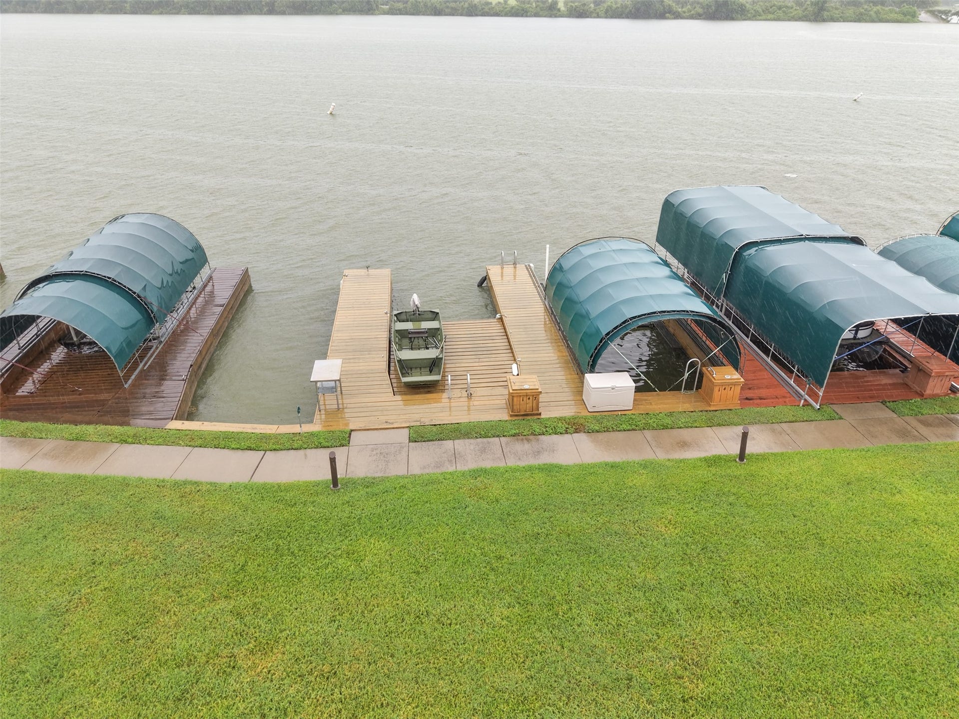 The boat enthusiast will love the three boat slips, one covered with a lift, one with a platform, and one open.
