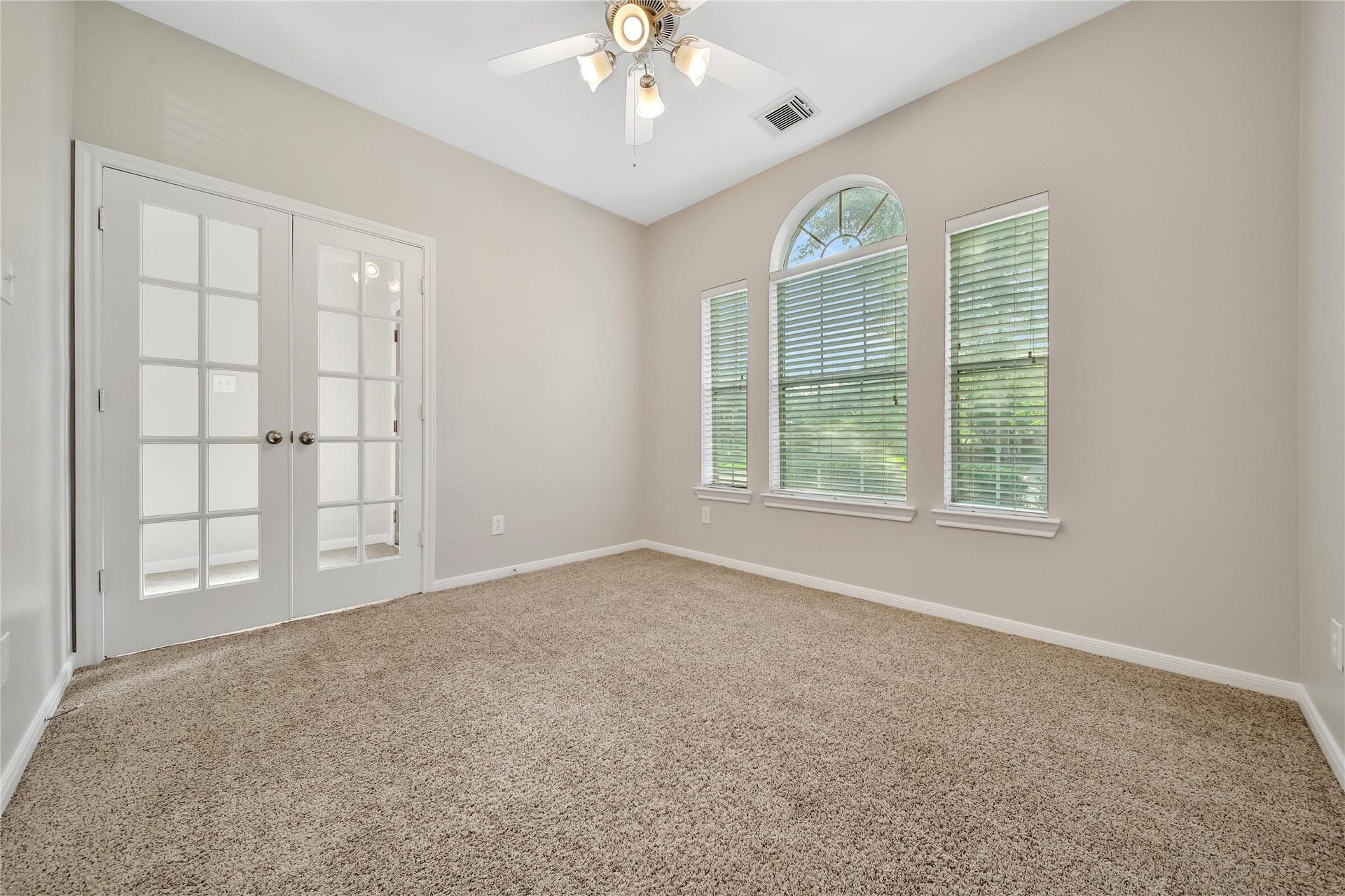 25604 Southwood Oaks Court, Porter, TX 77365 The study/flex room with french doors offers flexibility in how the space is used. Featuring a bright window to the front yard with views of the mature oak tree.