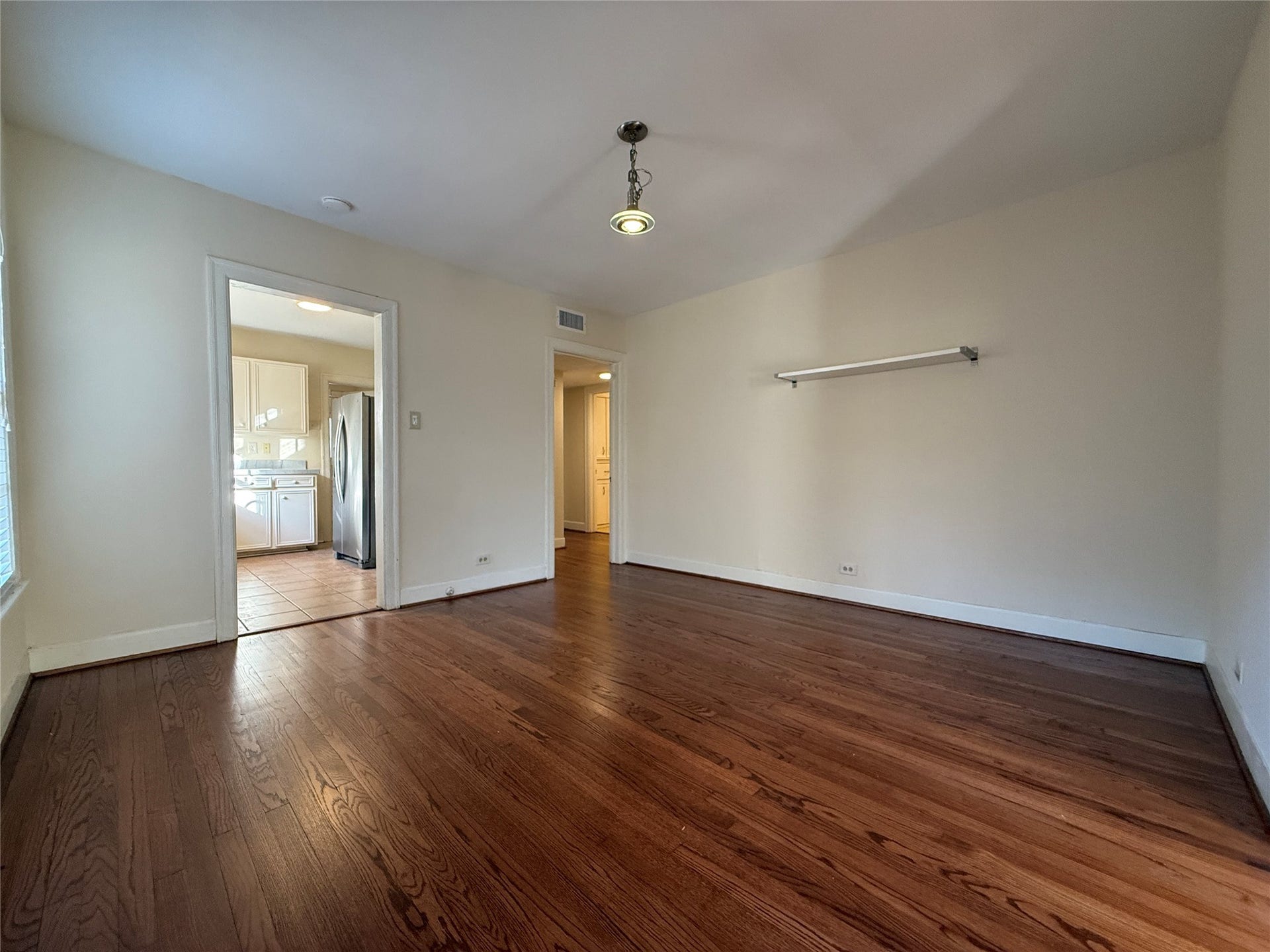 1968 Dryden Road, #1, Houston, TX 77030 The beautiful hardwood flooring extends into the dining room and beyond to the hallway and bedrooms.