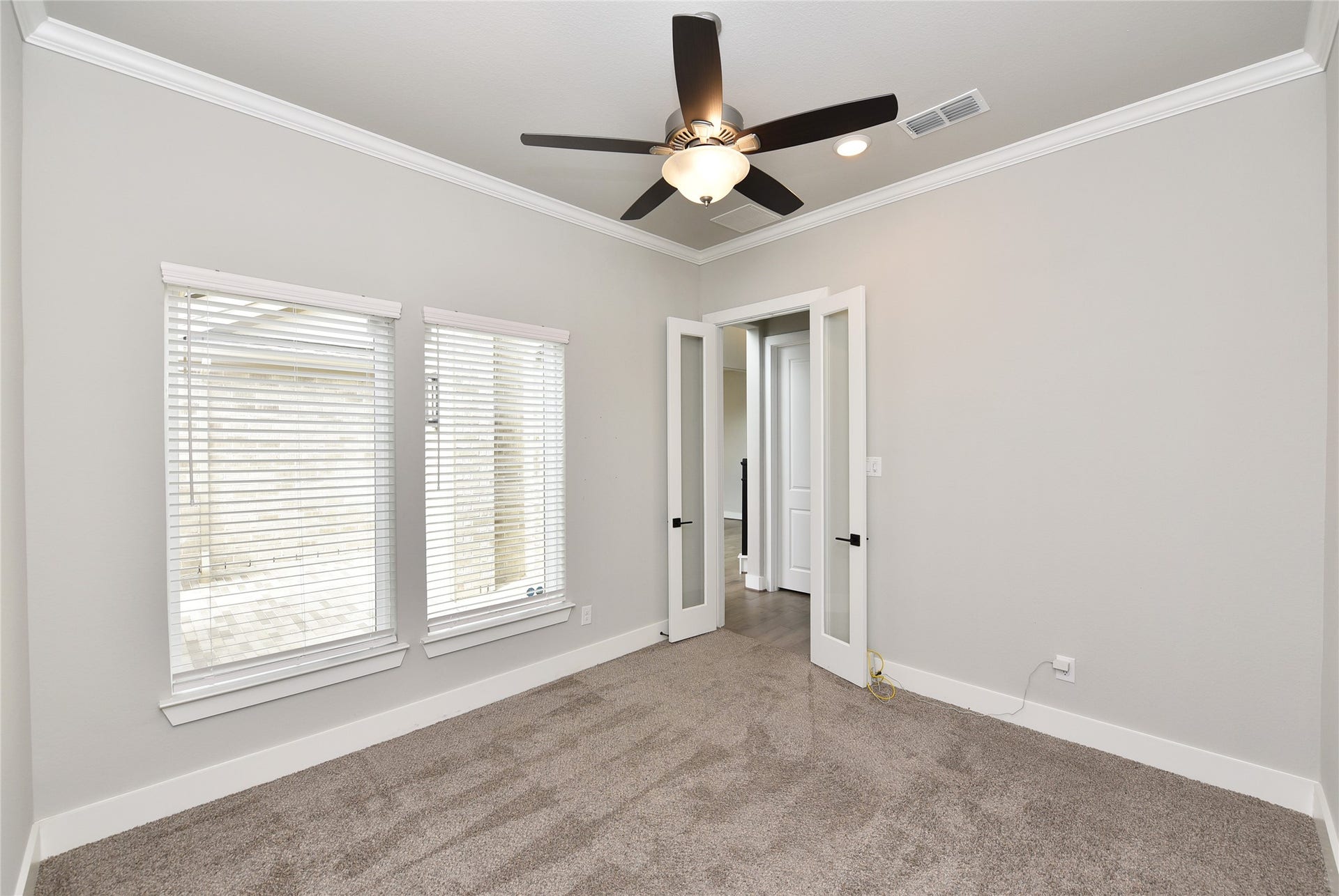 The private home office is just off the entry and a half bath is just across the hall.