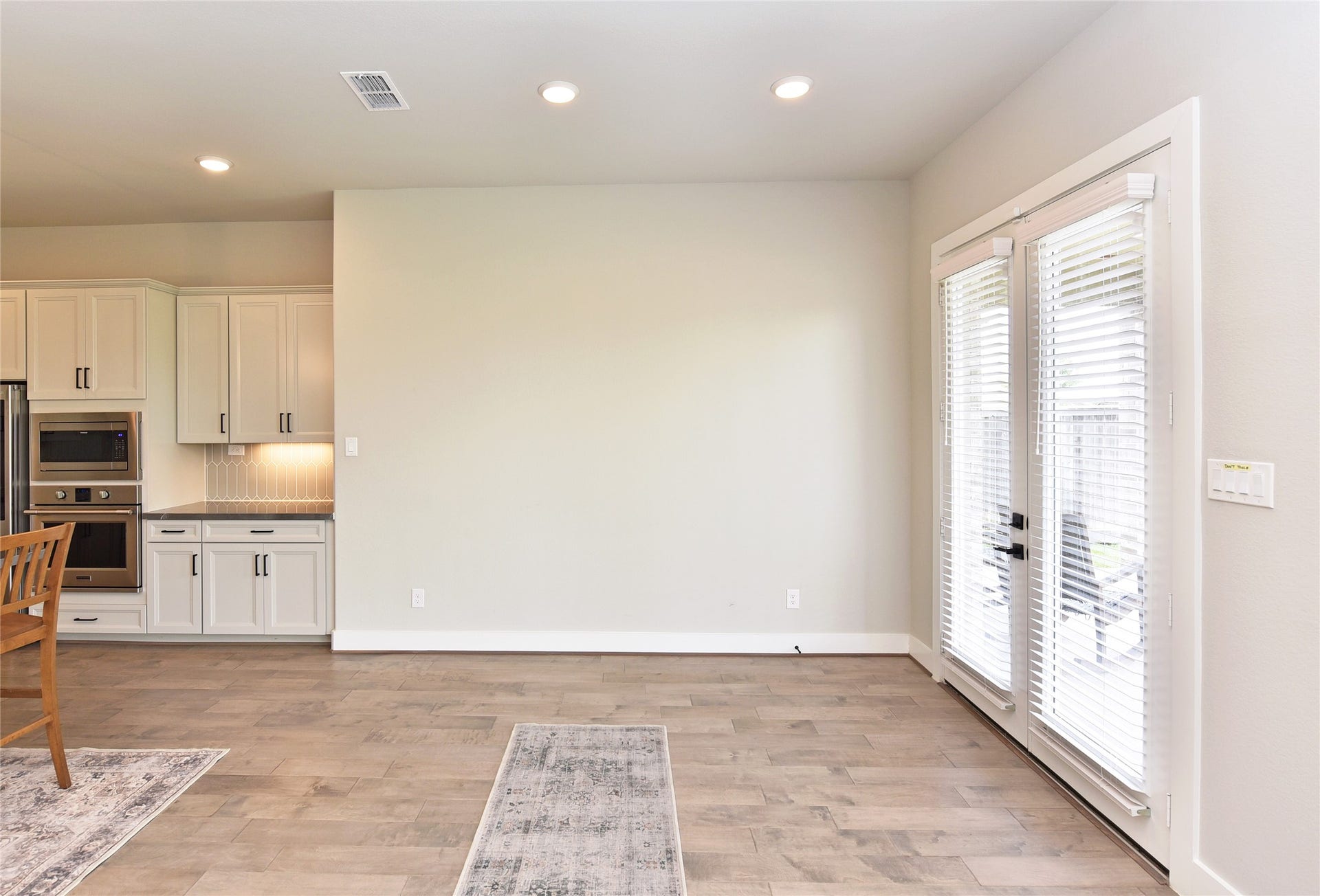Breakfast room.  Note french doors that step out onto back covered patio that is plumbed for an outdoor kitchen.