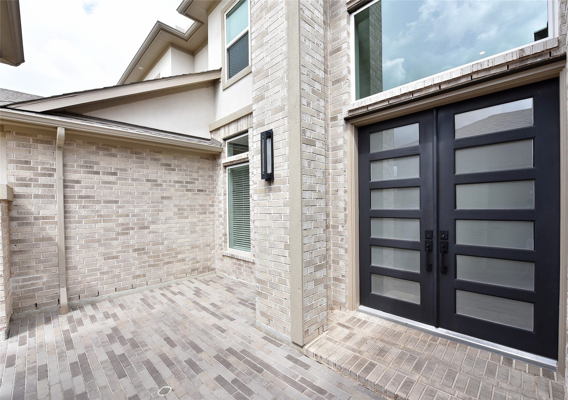 Heavy 8' double doors and courtyard are an impressive entry.