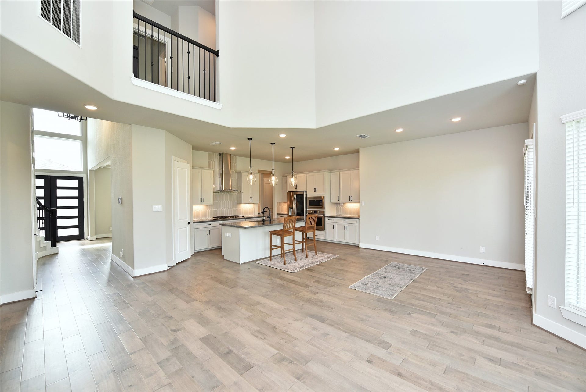 From the family room, see how the space is open to both kitchen and breakfast room