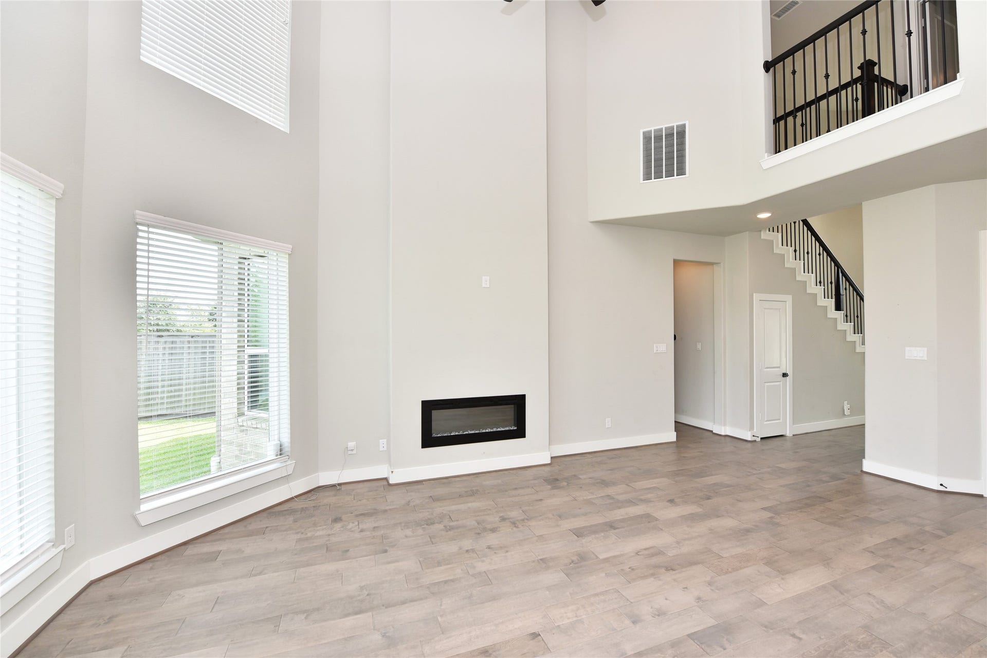 The family room's focal point is the contemporary electric fireplace.  Cozy on those frigid nights.