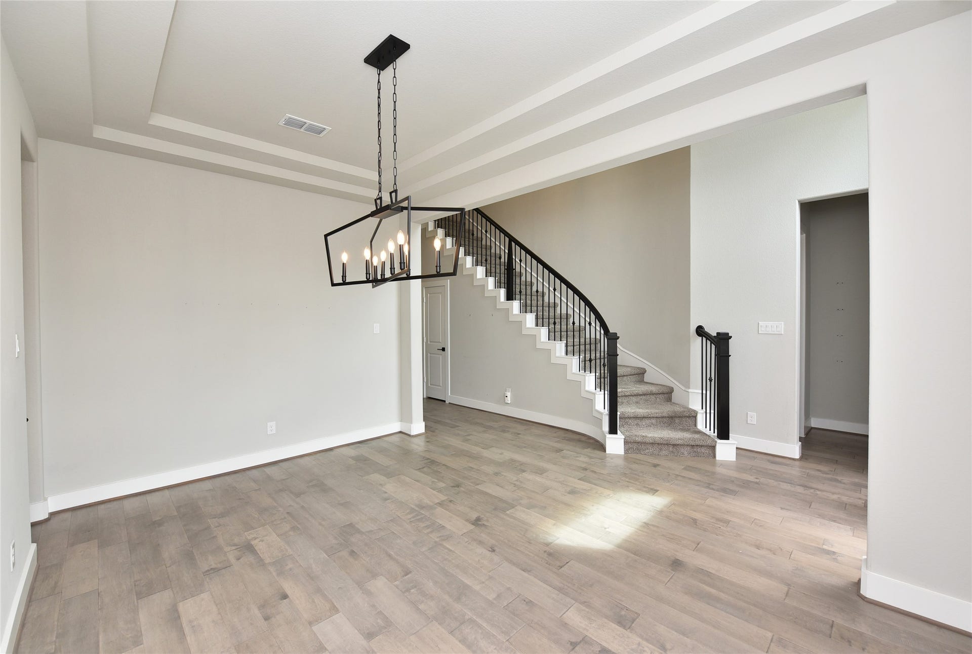 Looking at staircase from formal dining at entry.