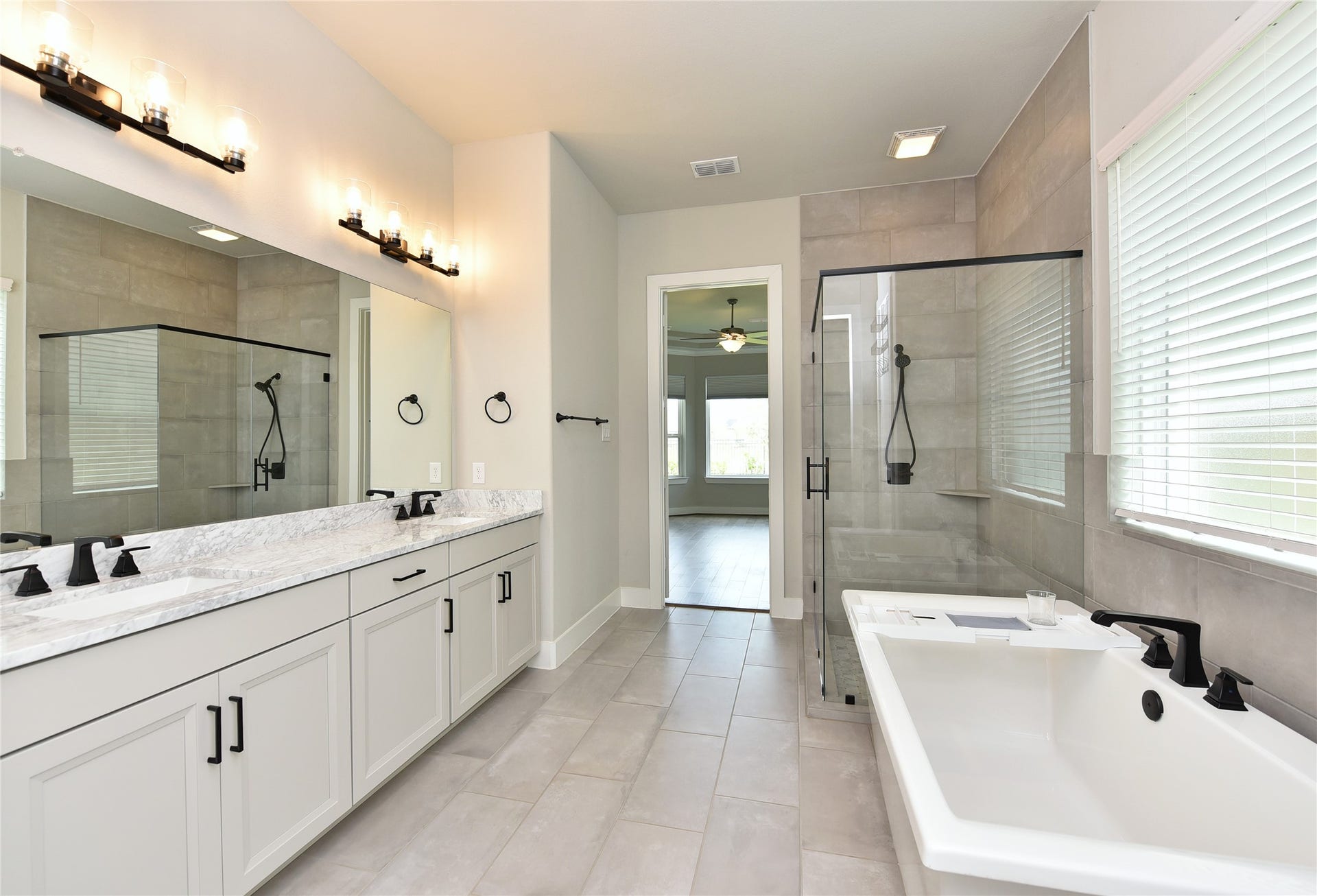 Soak your cares away in this primary bath with spa-like touches.