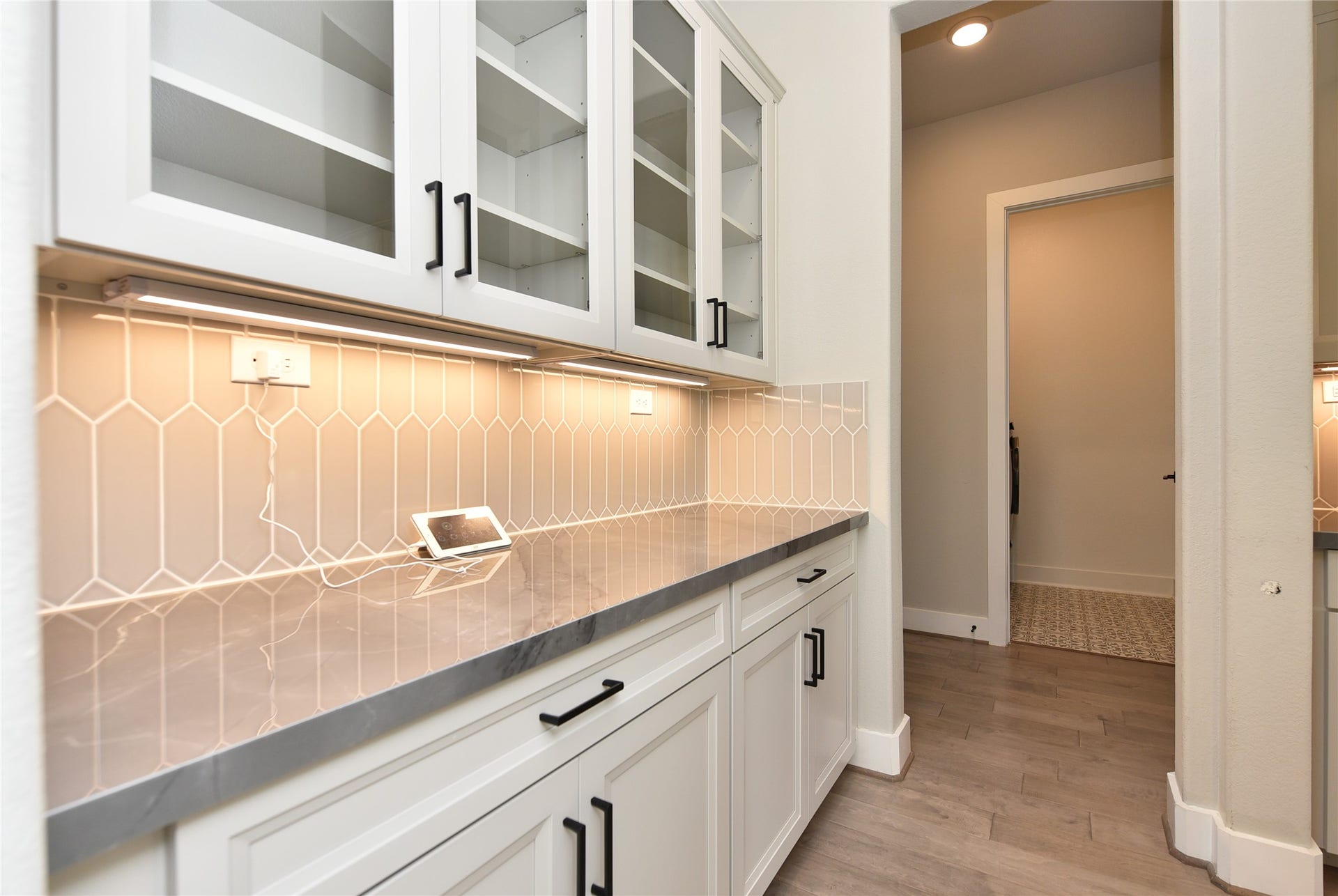 The butler pantry is just off the kitchen and offers a handy prep space just off the formal dining.  A MUST when entertaining!