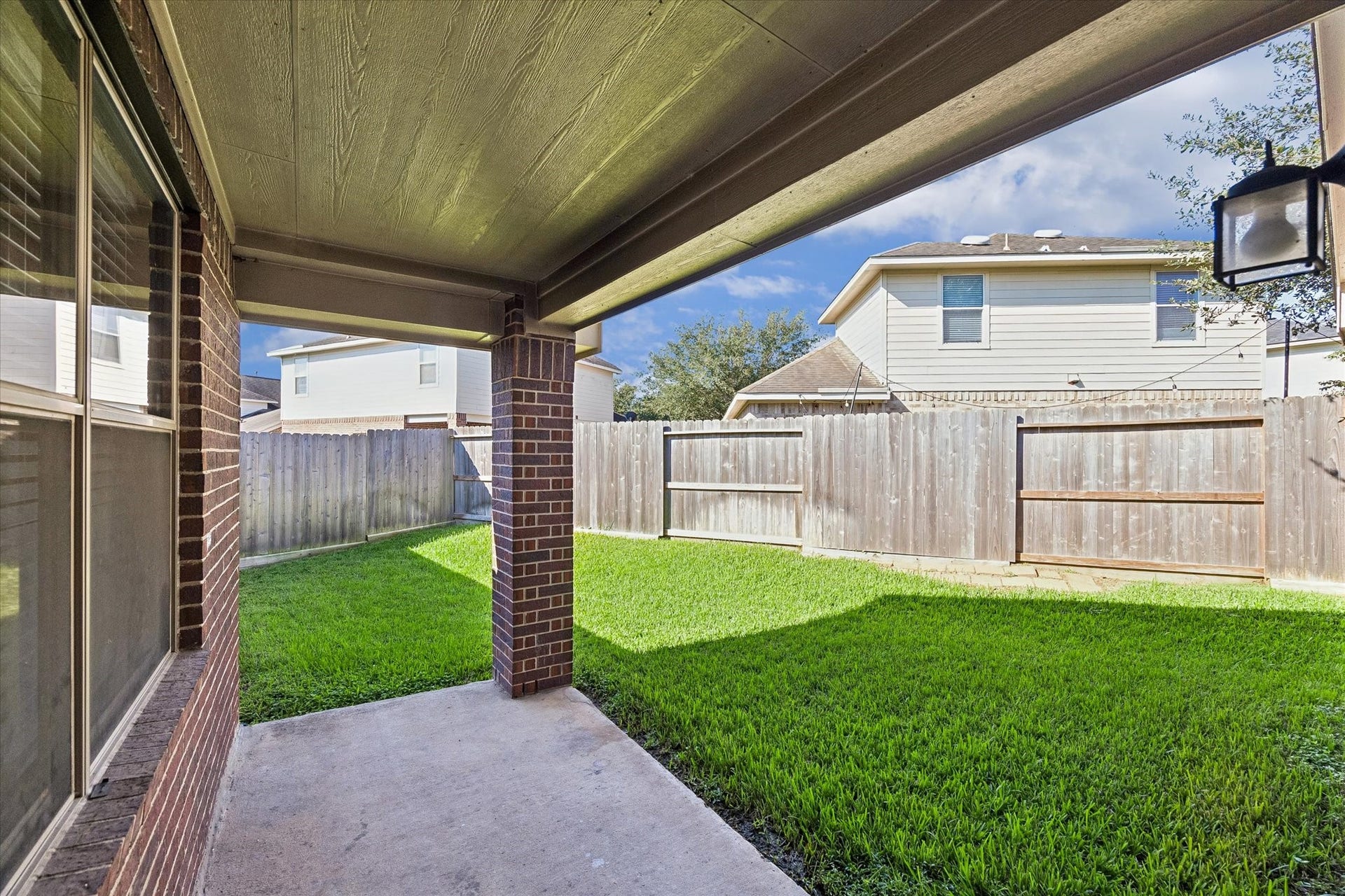 18127 Hillock Glen Lane, Cypress, TX 77429 Enjoy morning coffee, outdoor dining, or relaxing evenings on the covered back patio overlooking the fenced backyard.