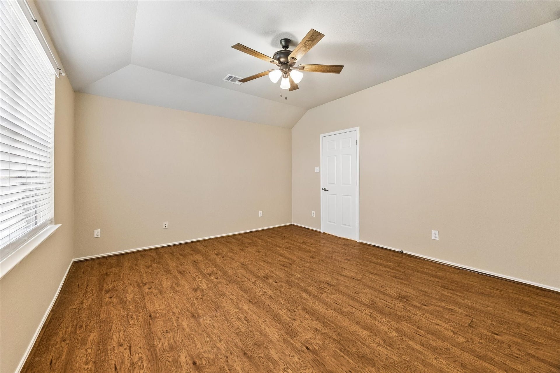 18127 Hillock Glen Lane, Cypress, TX 77429 Spacious primary suite featuring a NEW ceiling fan, wood-look flooring, and fresh interior paint.