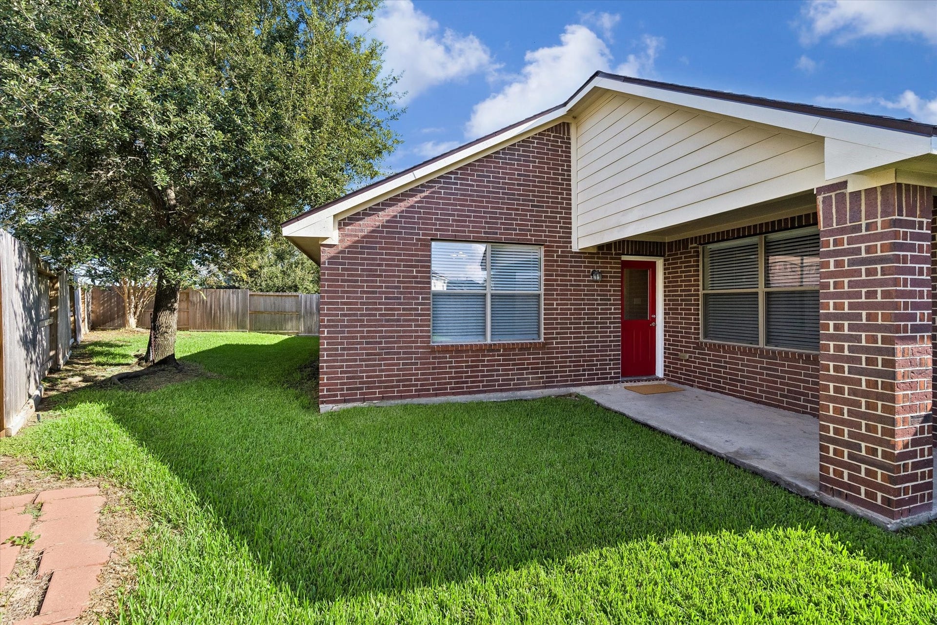 18127 Hillock Glen Lane, Cypress, TX 77429 Covered back patio with convenient access to the backyard. A comfortable spot for grilling, outdoor seating, or relaxing.
