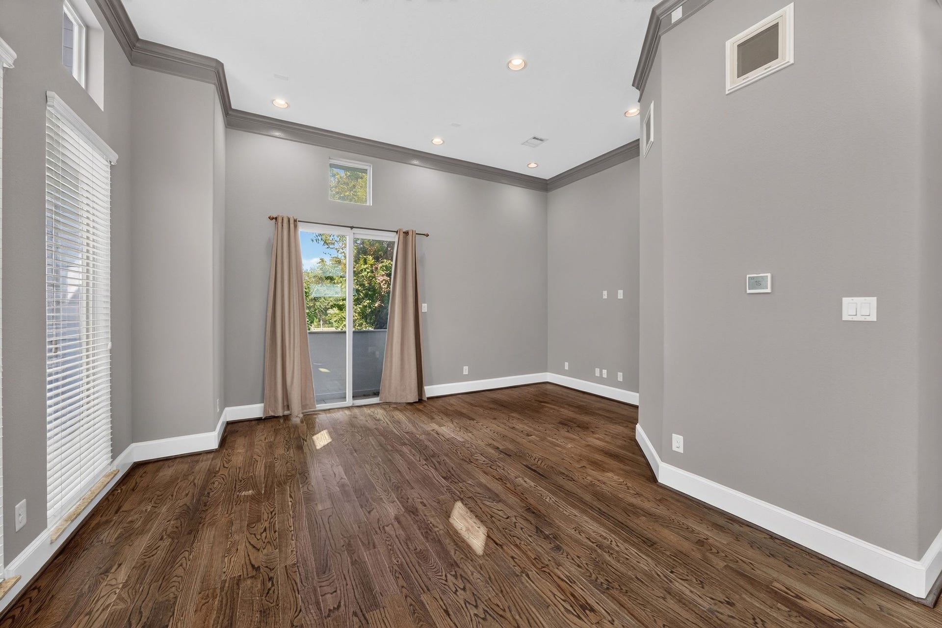 2307 Camden Drive, #C, Houston, TX 77021 Living and dining with hardwood floors and tall windows