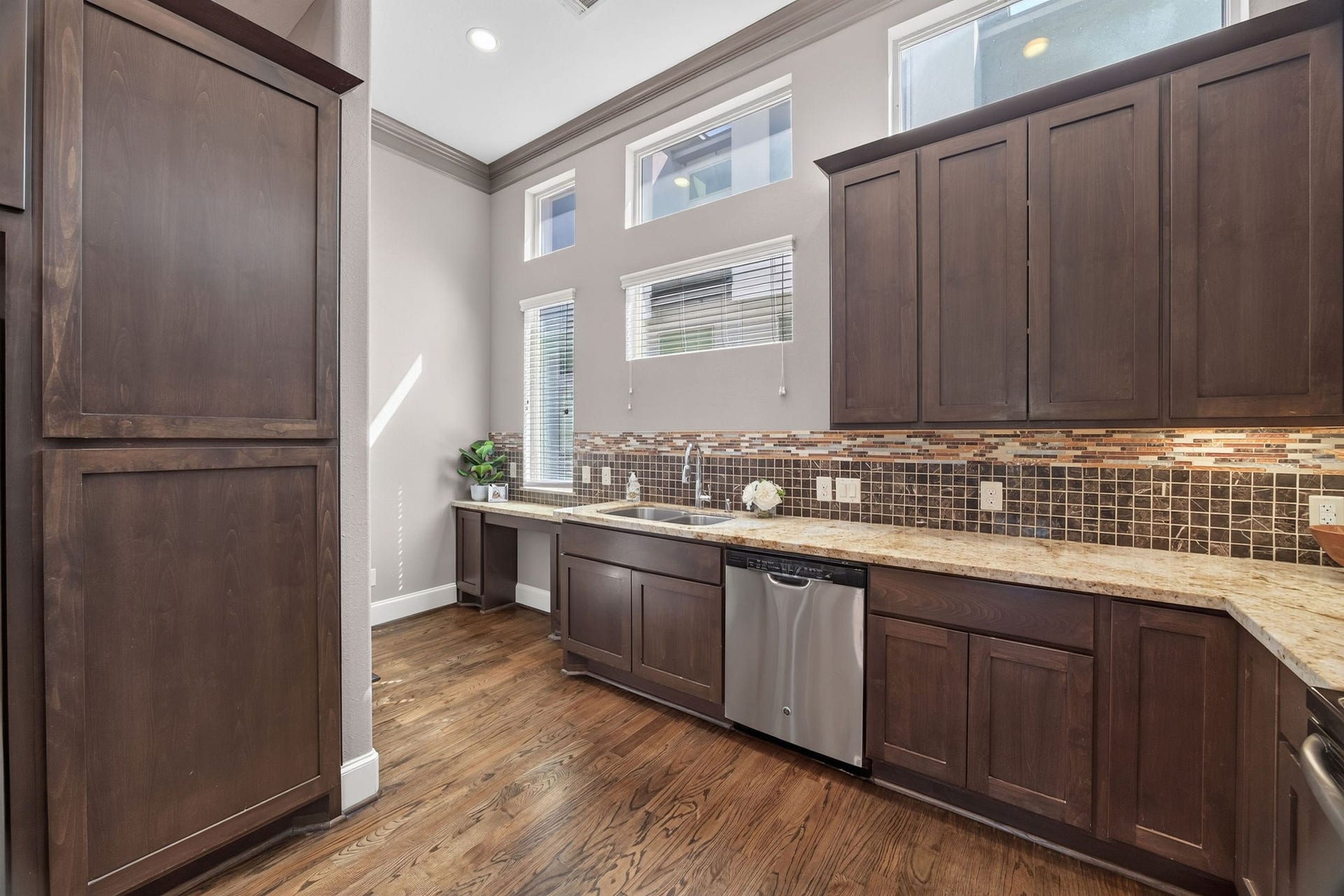 2307 Camden Drive, #C, Houston, TX 77021 Tall pantry cabinet, dishwasher, and clerestory windows