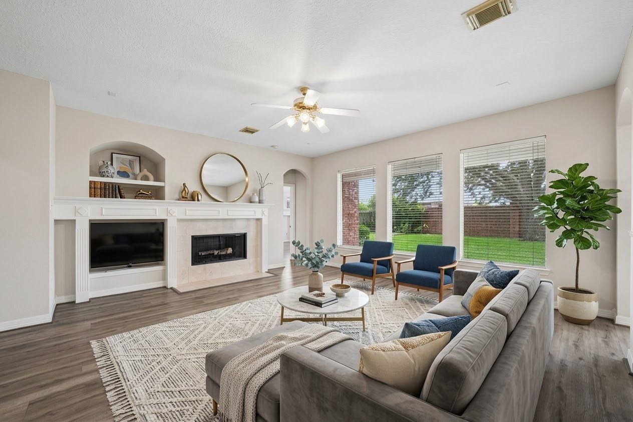 5807 Bayberry Way, Sugar Land, TX 77479 Living Room / Family Room - Spacious and welcoming living area. Large windows provide plenty of natural light, creating an open and comfortable atmosphere.