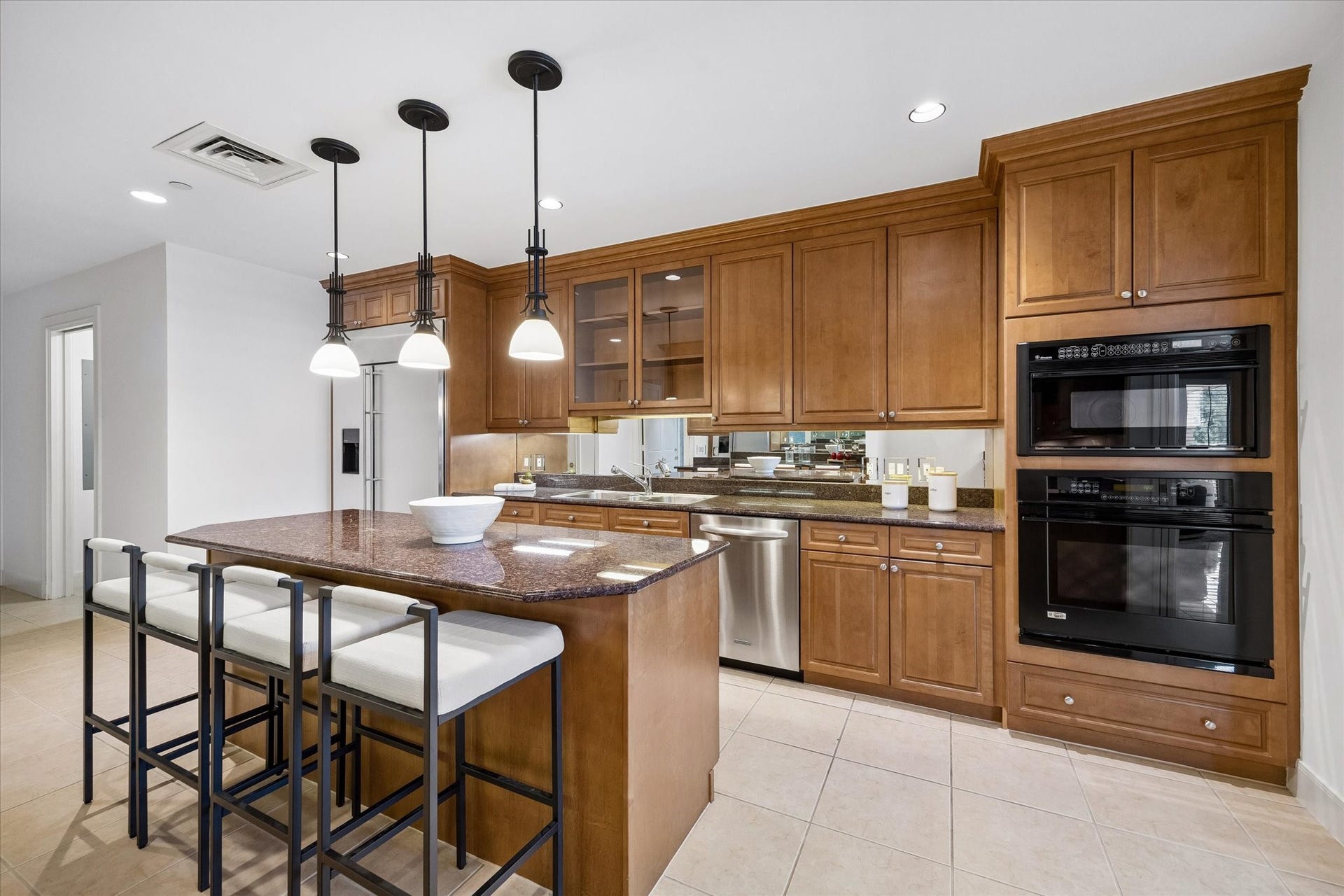 Kitchen has GE Monogram appliances.  Doorway to left is utility room.