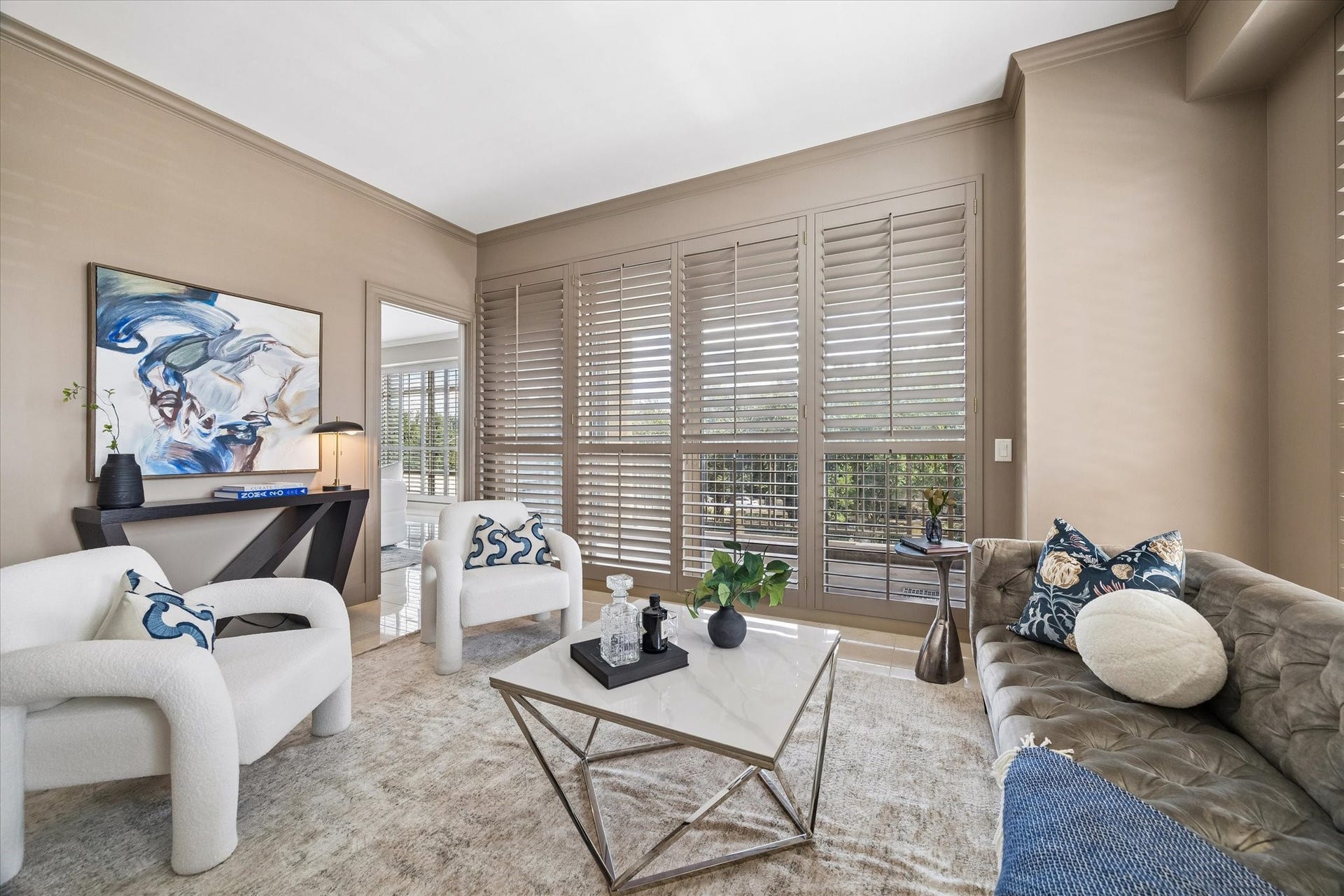 Study has pocket doors to living room and balcony access.