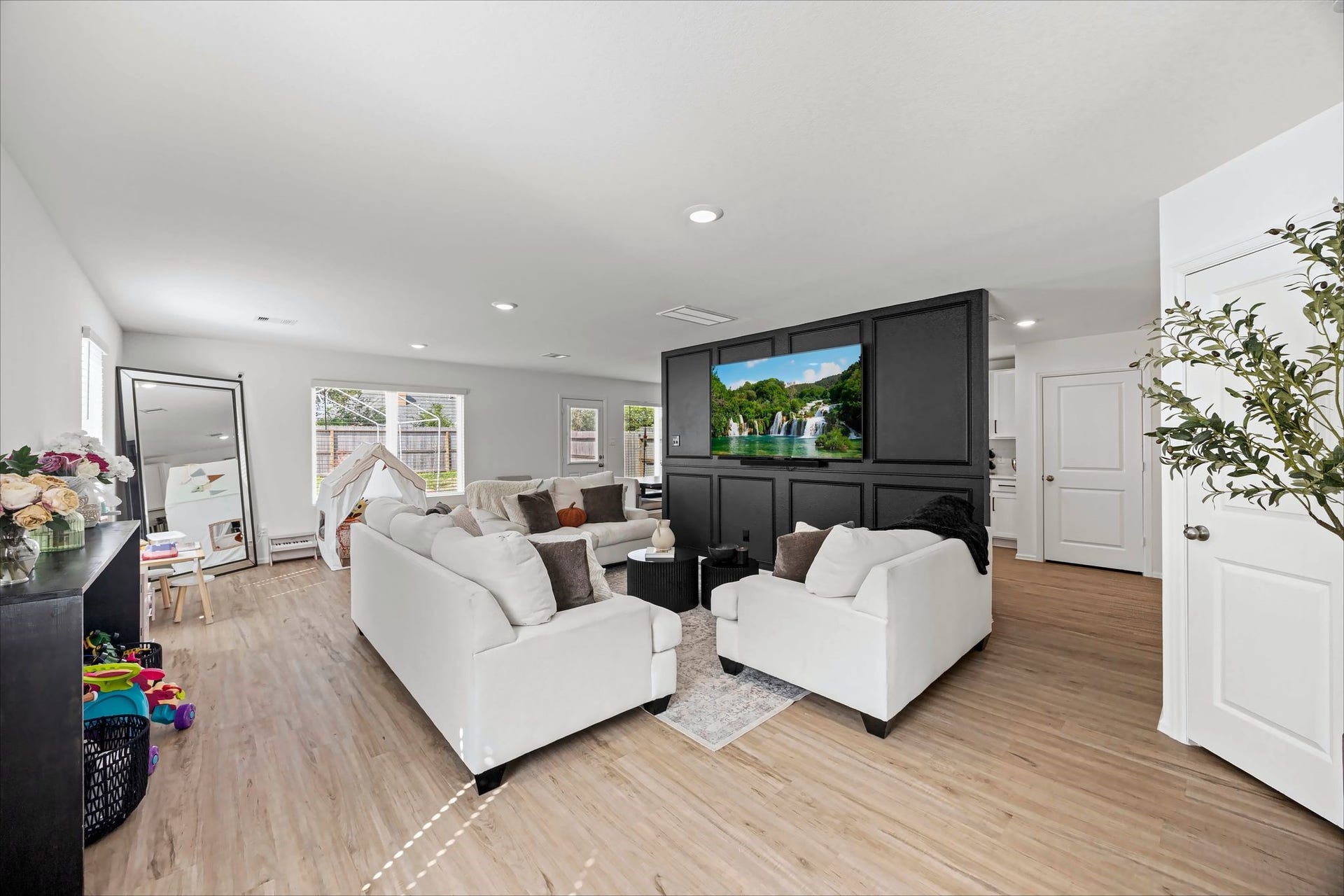 17811 Pemswood Drive, Hockley, TX 77447 Open living room with recessed lighting and a feature wall for the TV