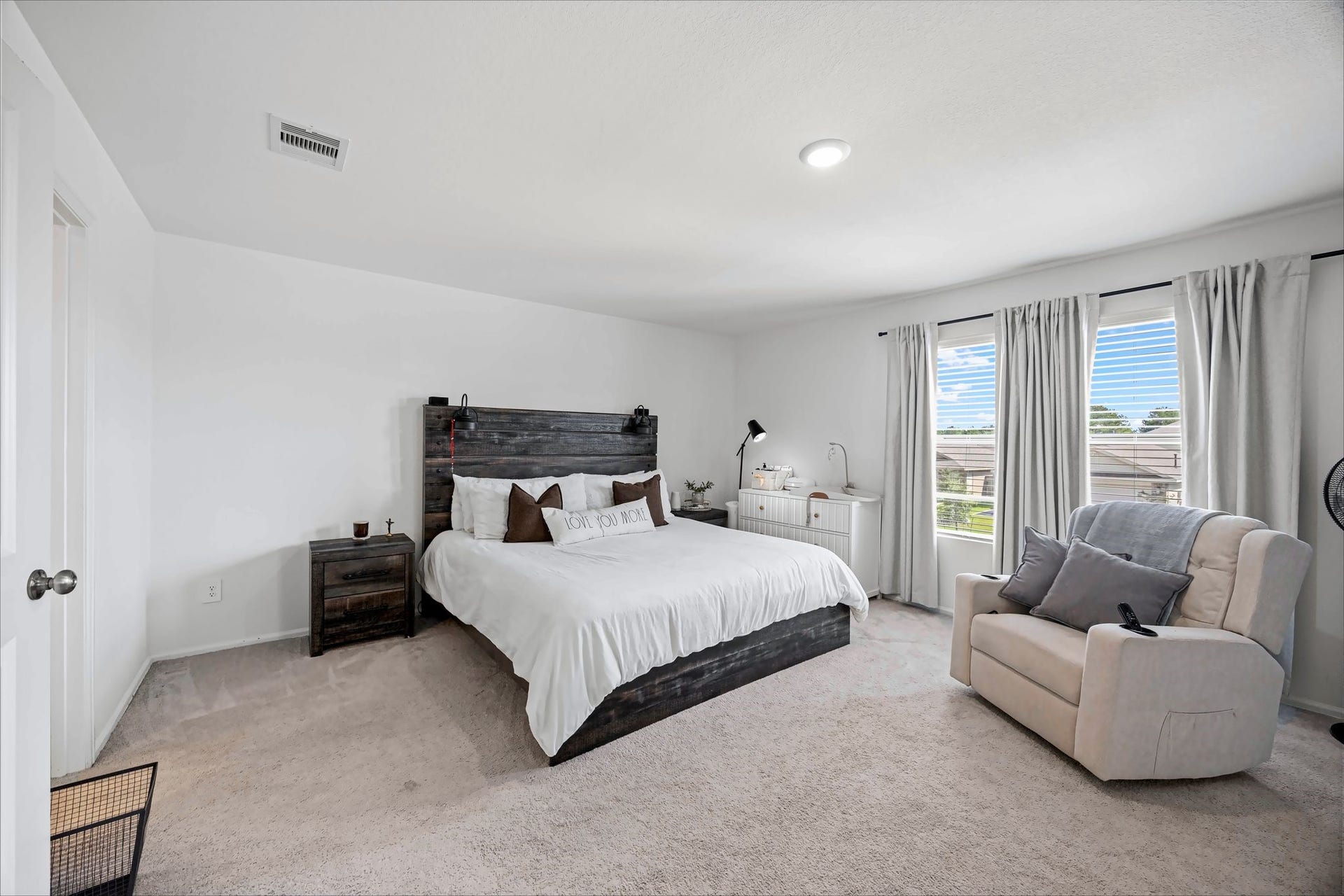 17811 Pemswood Drive, Hockley, TX 77447 Primary bedroom with carpet and windows for natural light