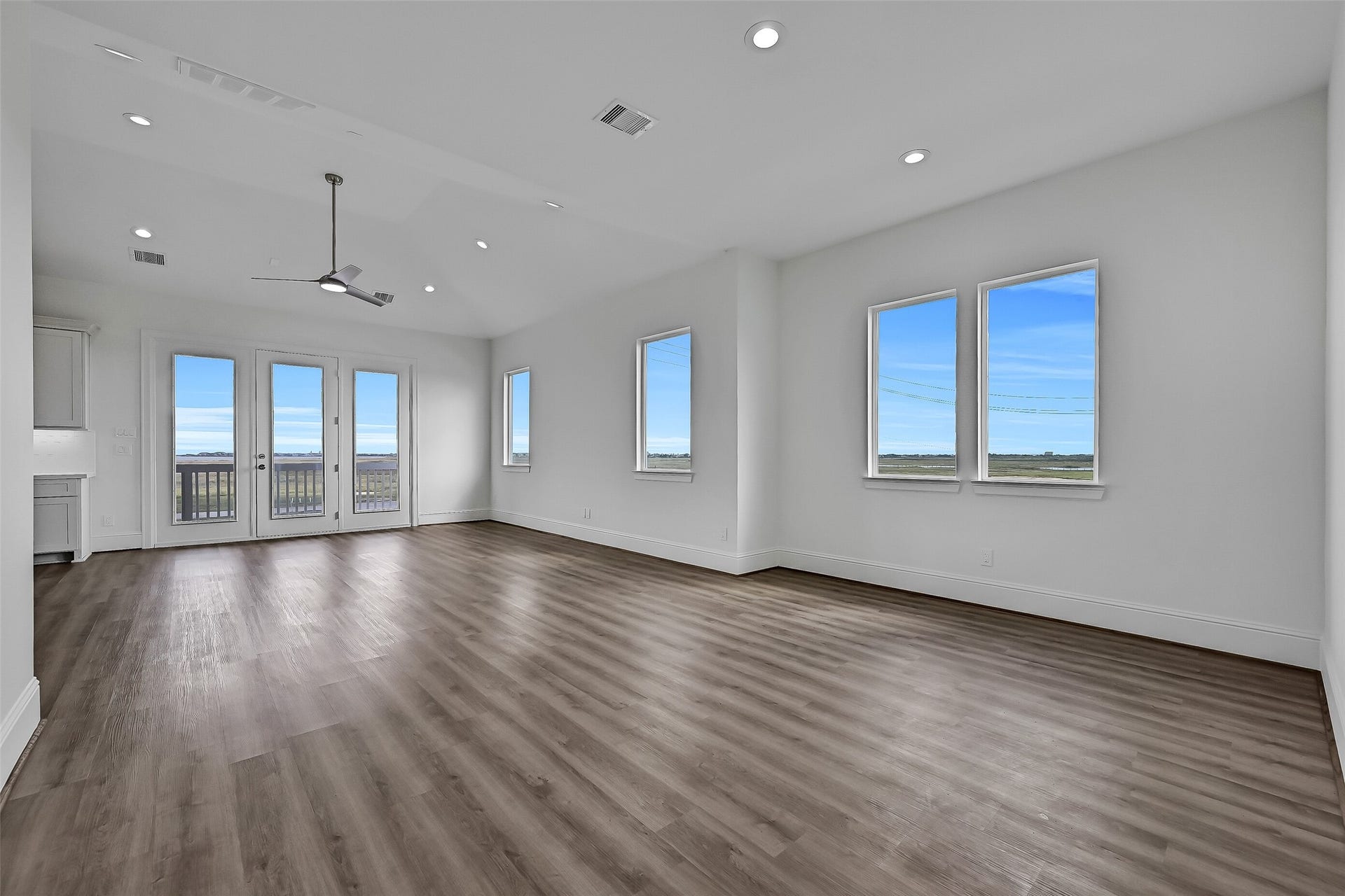 1627 Bay Pointe Drive, Galveston, TX 77554 The open-concept living and dining areas offer a spacious, versatile layout with plenty of flexibility to arrange and customize the space to suit your needs.