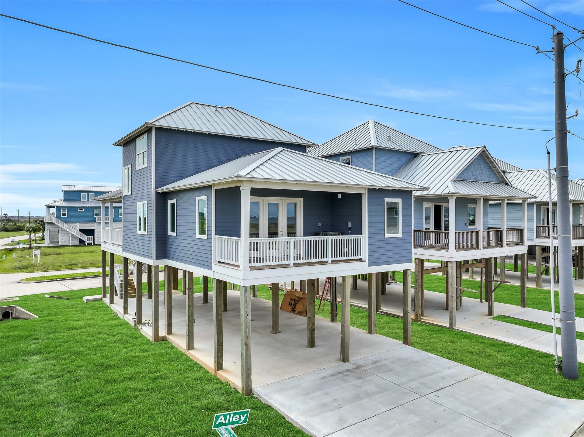 1627 Bay Pointe Drive, Galveston, TX 77554 The double-wide driveway and additional carport provide ample parking space for multiple vehicles and guests.