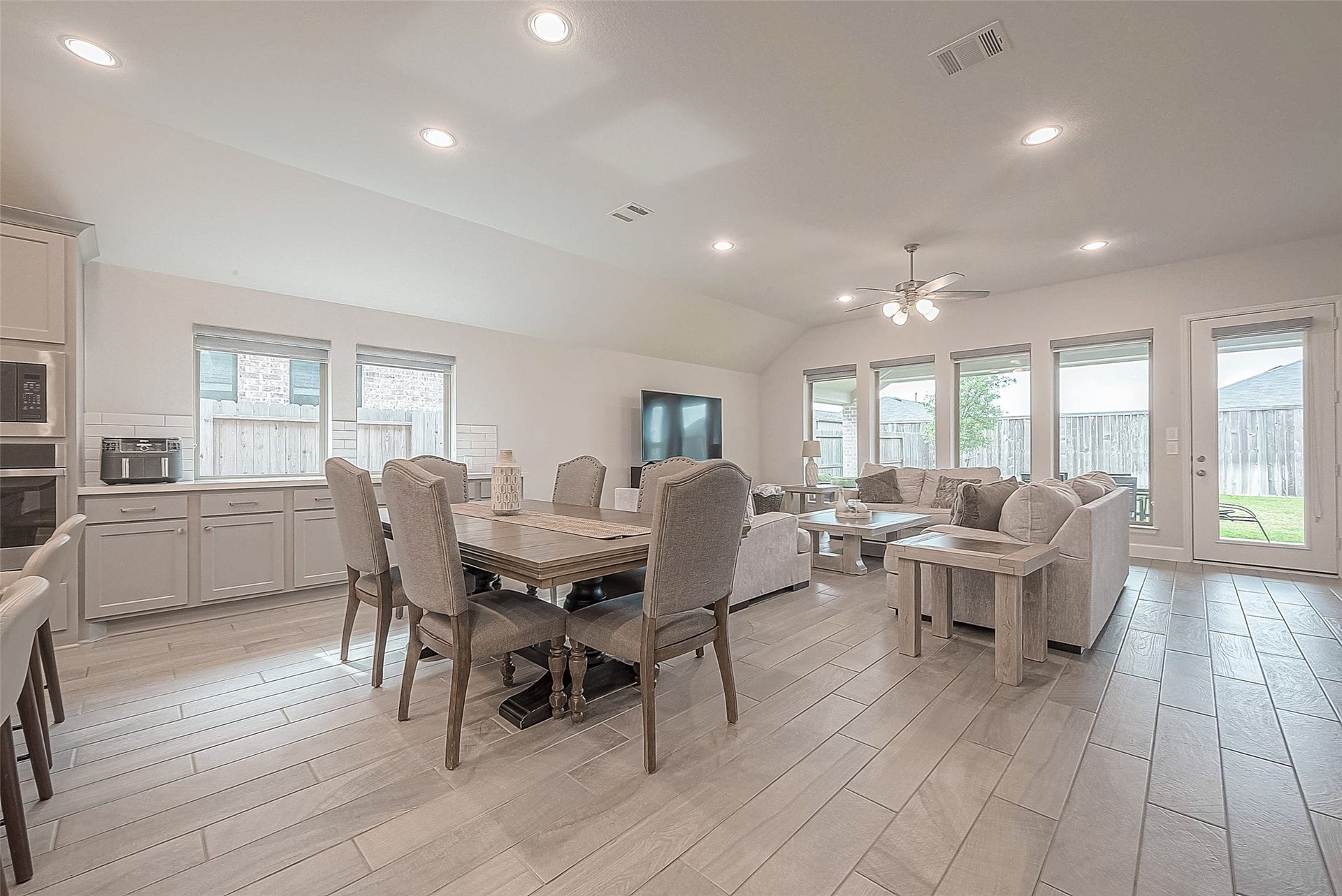 29042 Hauter Way, Fulshear, TX 77441 Open dining and living areas with a spacious layout