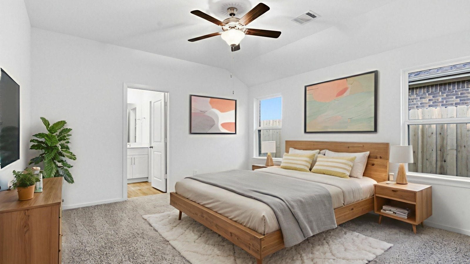 3510 Wild Mustang Street, League City, TX 77511 A spacious primary bedroom emphasizing open space and natural lighting with large windows.