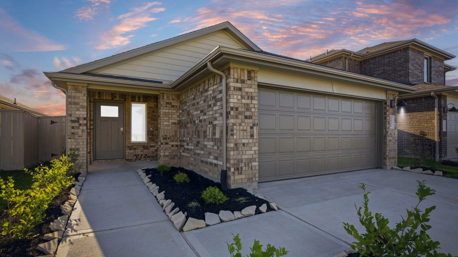 3510 Wild Mustang Street, League City, TX 77511 Newly built single story home with traditional architecture, a garage, and landscaped front yard.