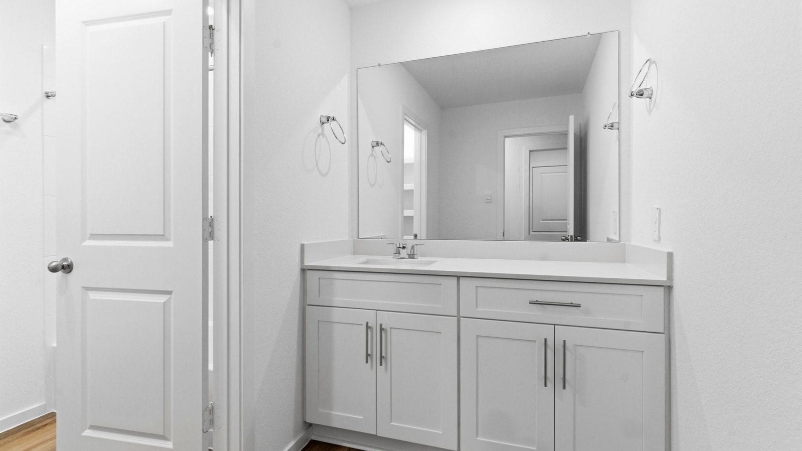 3510 Wild Mustang Street, League City, TX 77511 A well-designed bathroom equipped with quartz countertops, a standing tub, and a single vanity.