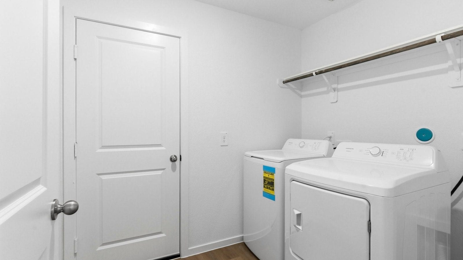 3510 Wild Mustang Street, League City, TX 77511 A laundry room featuring washer and dryer connections, neatly arranged with ample space for laundry tasks and storage.
