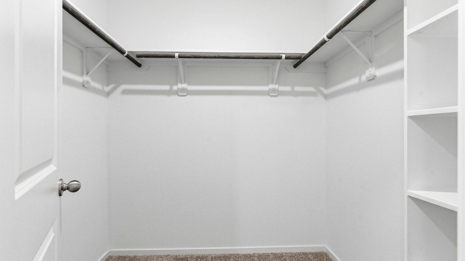 3510 Wild Mustang Street, League City, TX 77511 A spacious walk-in closet off the primary bathroom with multiple hanging rods, and shelves for maximum storage capabilities.
