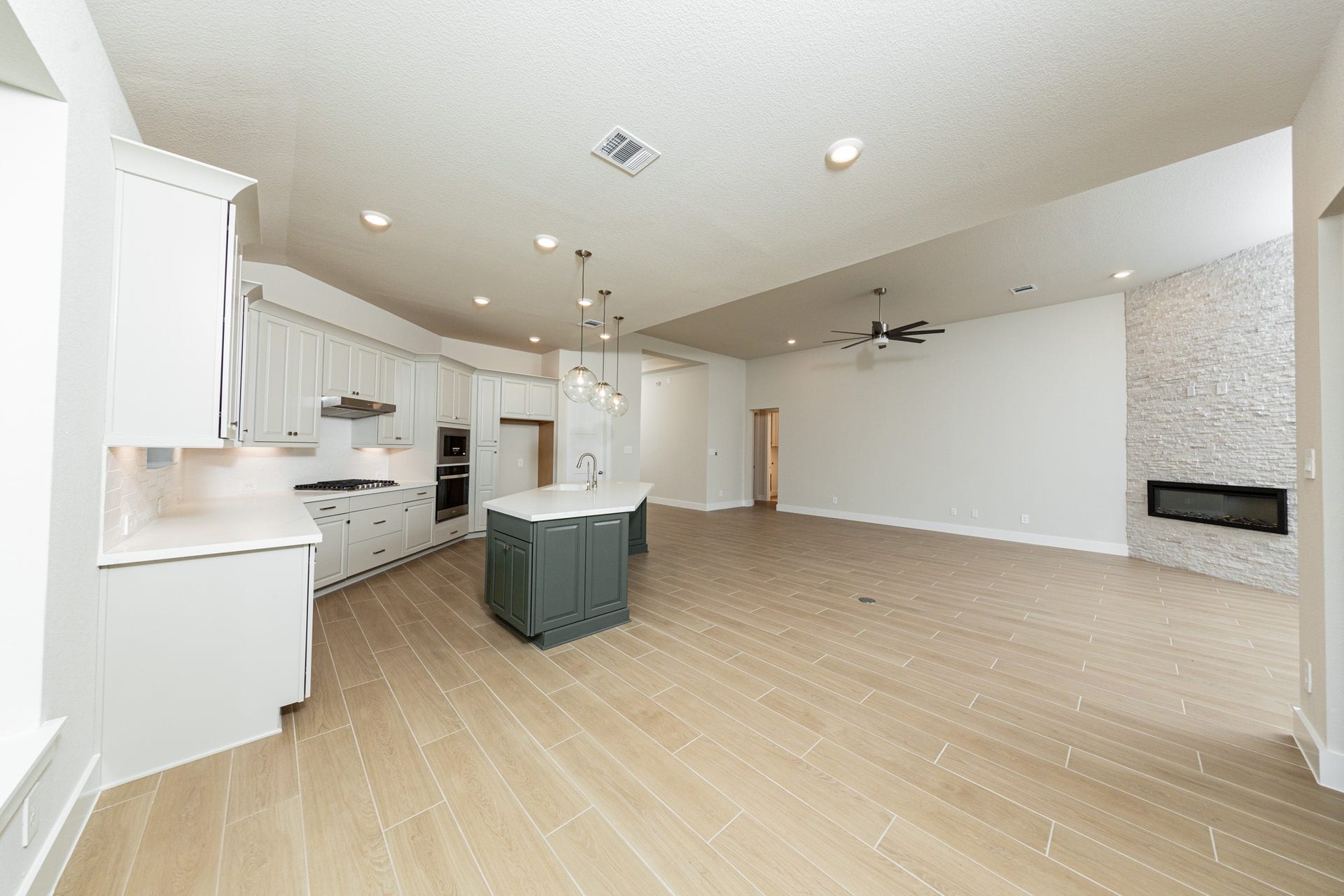 1915 Langford Street, Montgomery, TX 77316 Stunning open-concept design seamlessly connecting the living, dining, and kitchen areasperfect for both everyday living and entertaining!