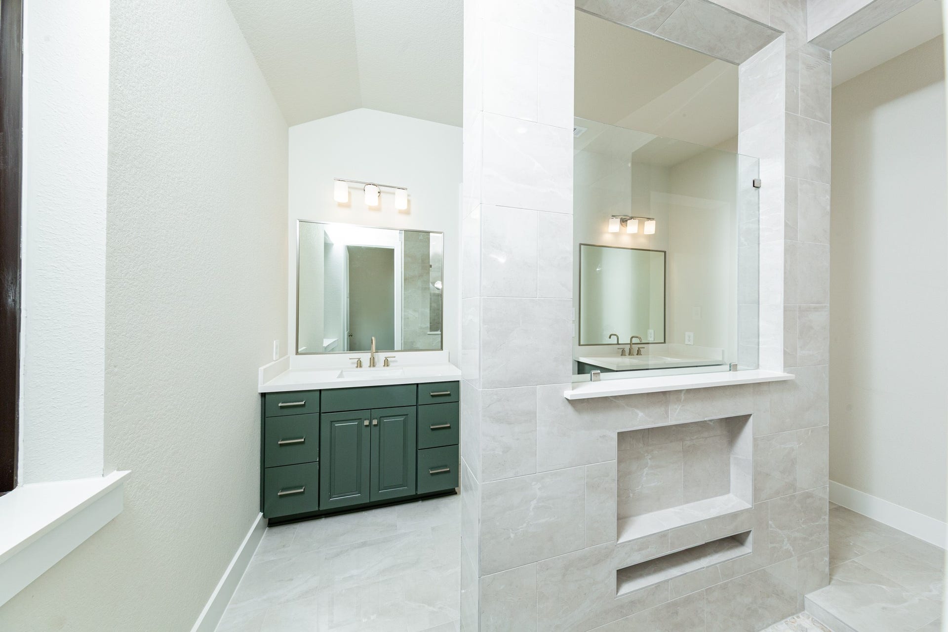 1915 Langford Street, Montgomery, TX 77316 Additional view of the primary bathroom vanity area and open walk-in shower.