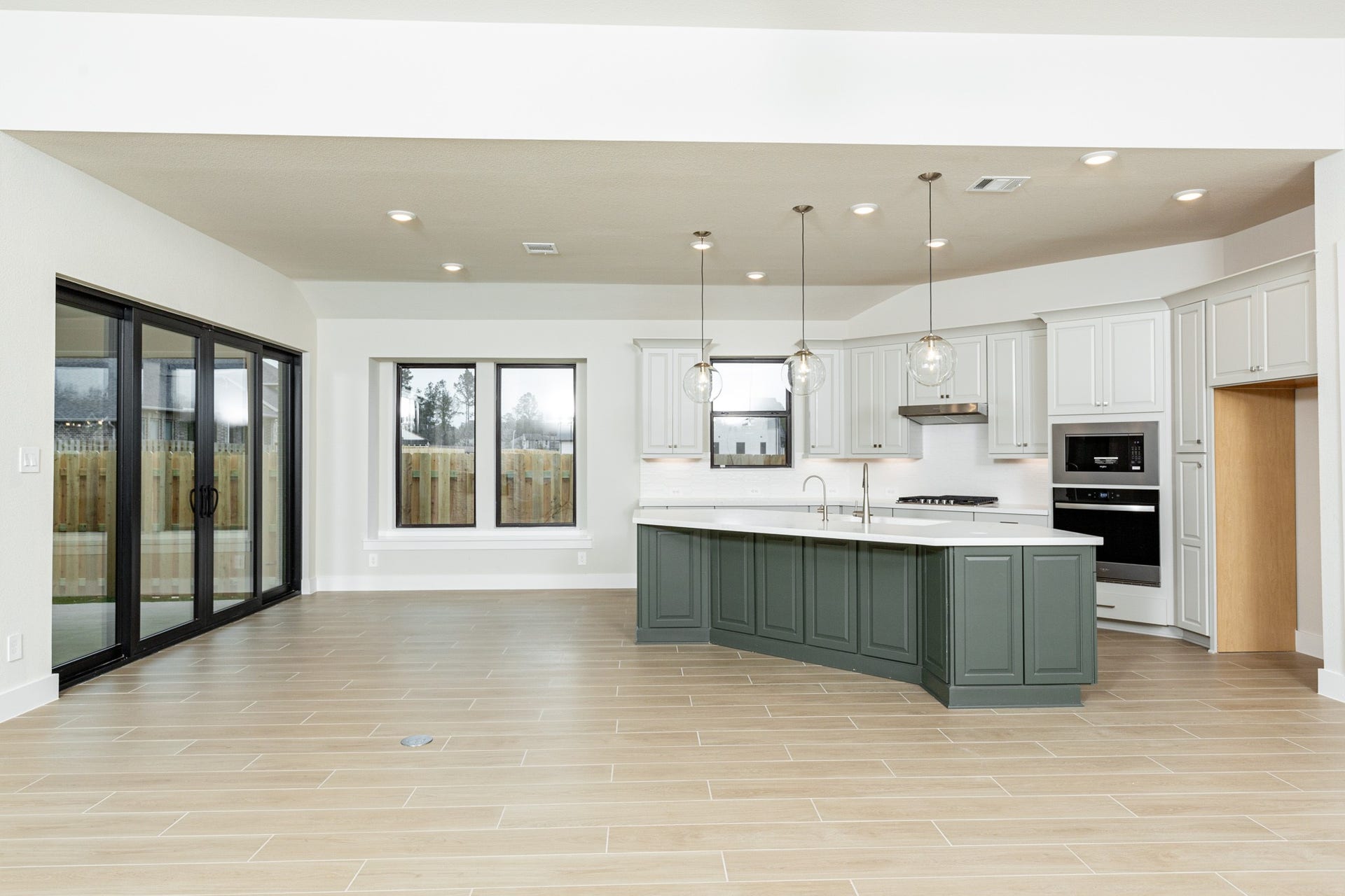 1915 Langford Street, Montgomery, TX 77316 Create lasting memories around the table with family and friends in the dining! It showcases high ceilings, large windows, tile flooring, and recessed lighting for a warm and welcoming atmosphere.