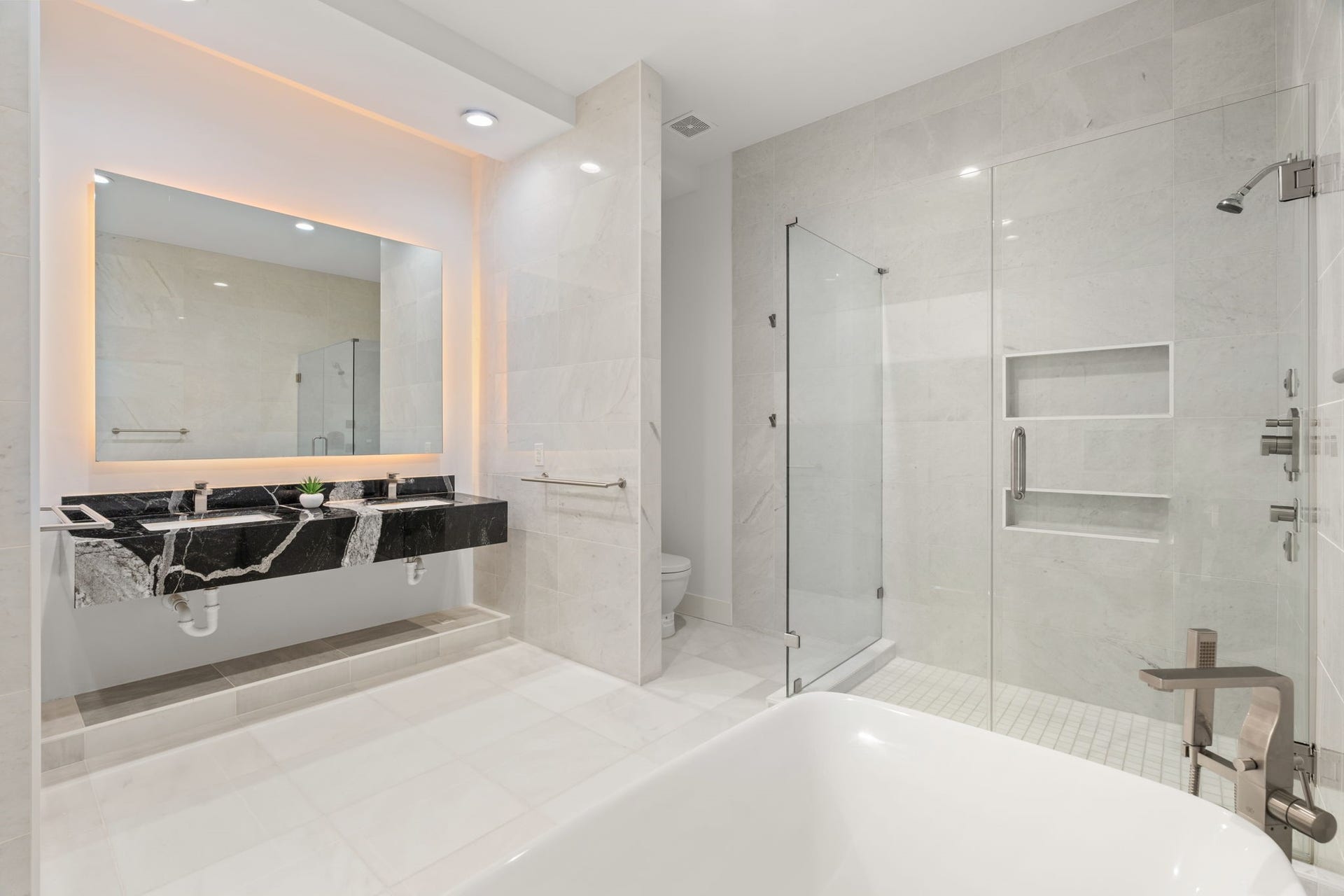2120 Southgate Boulevard, Houston, TX 77030 Prime marble bath showcases double sinks placed delicately within solid granite countertop