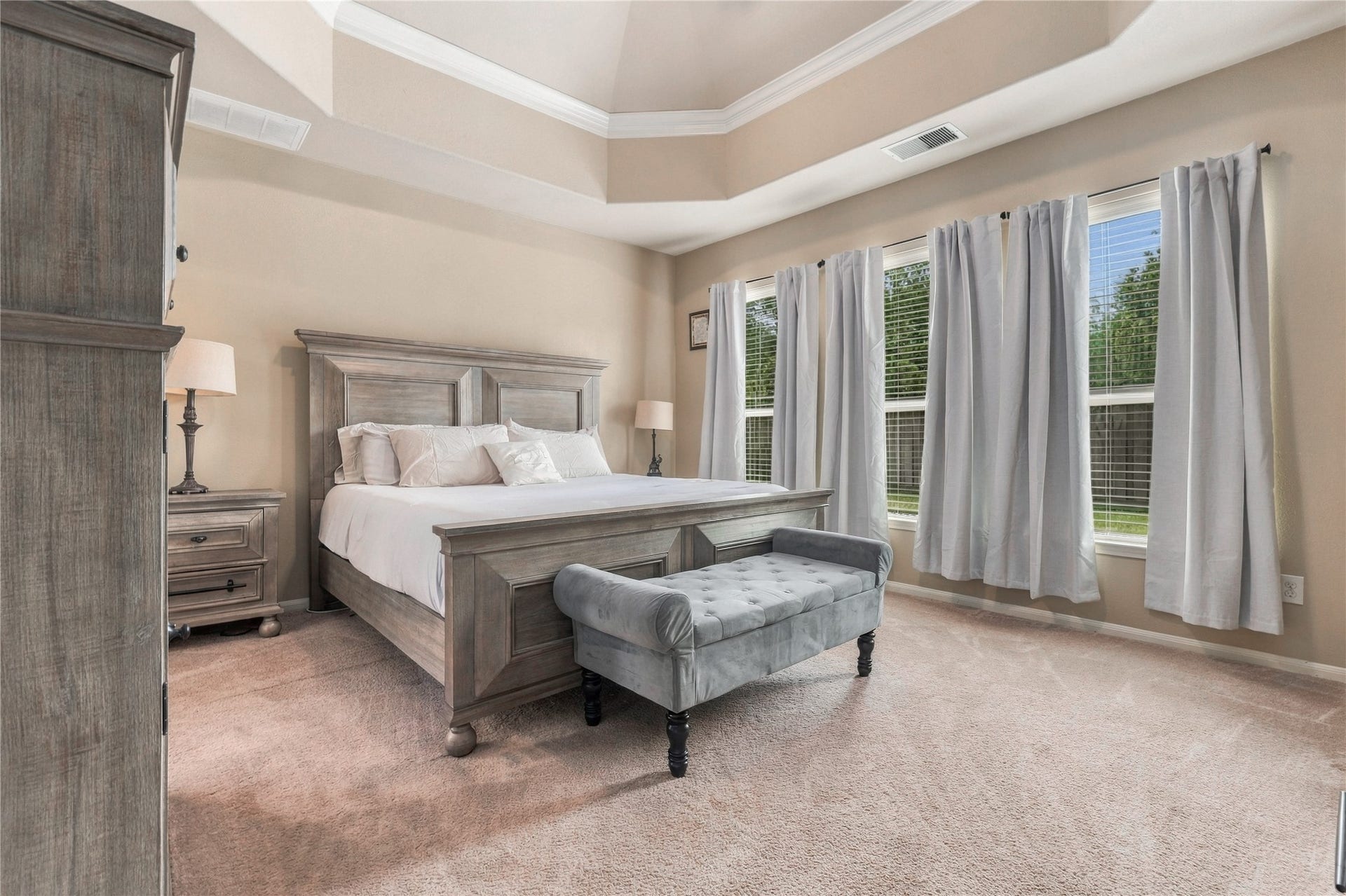 20815 S Blue Hyacinth Drive, Cypress, TX 77433 Large windows bring natural light into the primary suite while the spacious footprint leaves plenty of breathing room around the furniture.