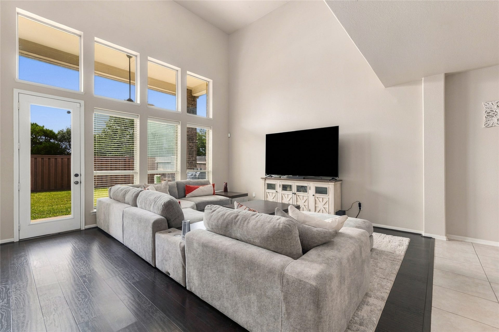 20815 S Blue Hyacinth Drive, Cypress, TX 77433 The living room immediately draws your attention to the wall of tall windows overlooking the backyard and filling the room with natural light.
