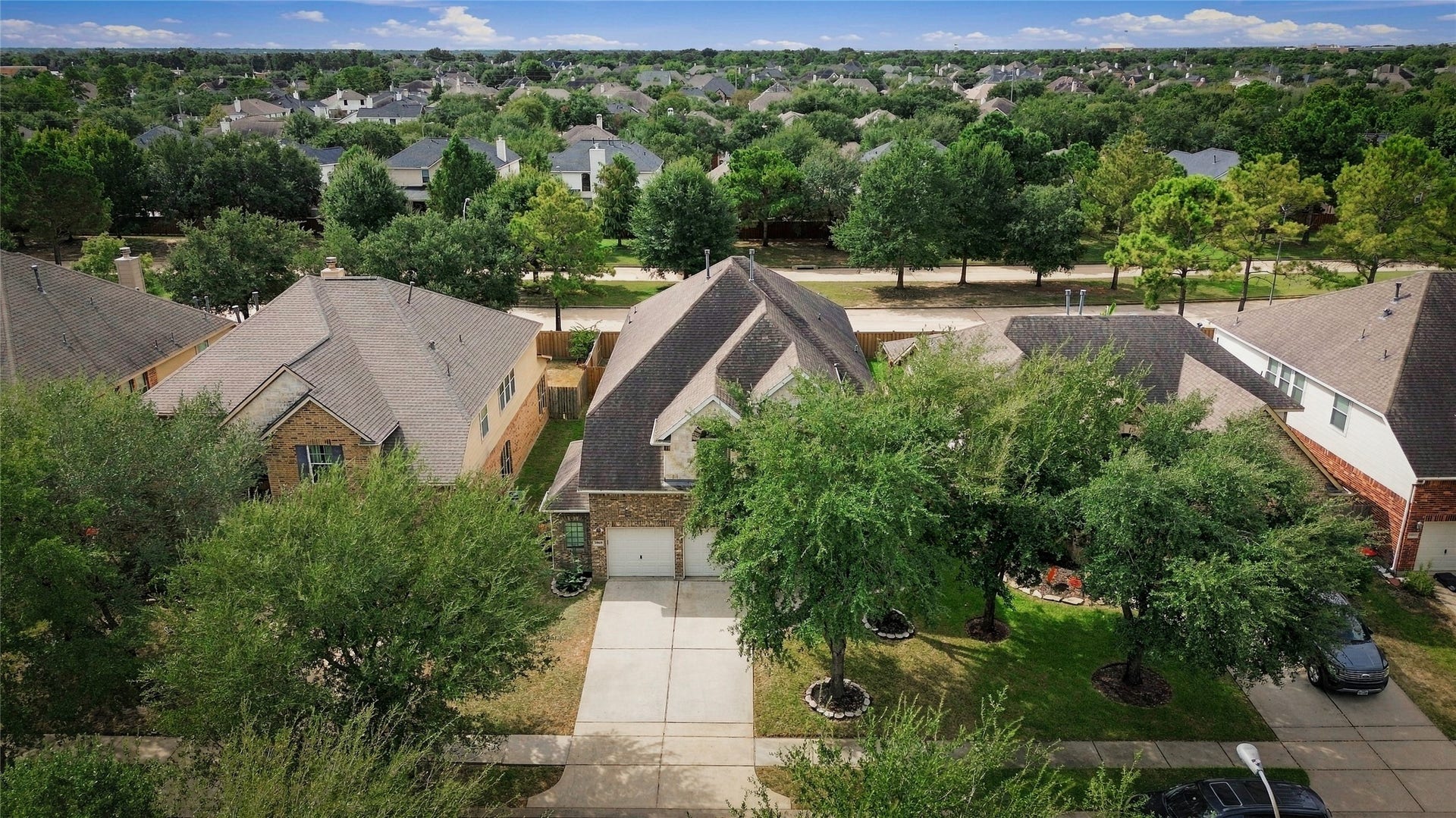 20815 S Blue Hyacinth Drive, Cypress, TX 77433 Mature trees weave throughout the neighborhood, creating a welcoming and established setting.
