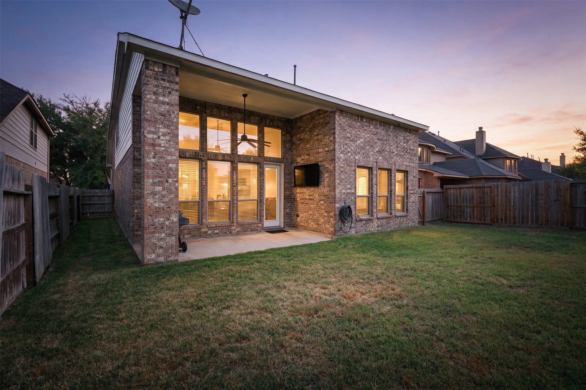 20815 S Blue Hyacinth Drive, Cypress, TX 77433 The brick exterior and tall rear windows create a beautiful backdrop without taking away from the usable yard space.