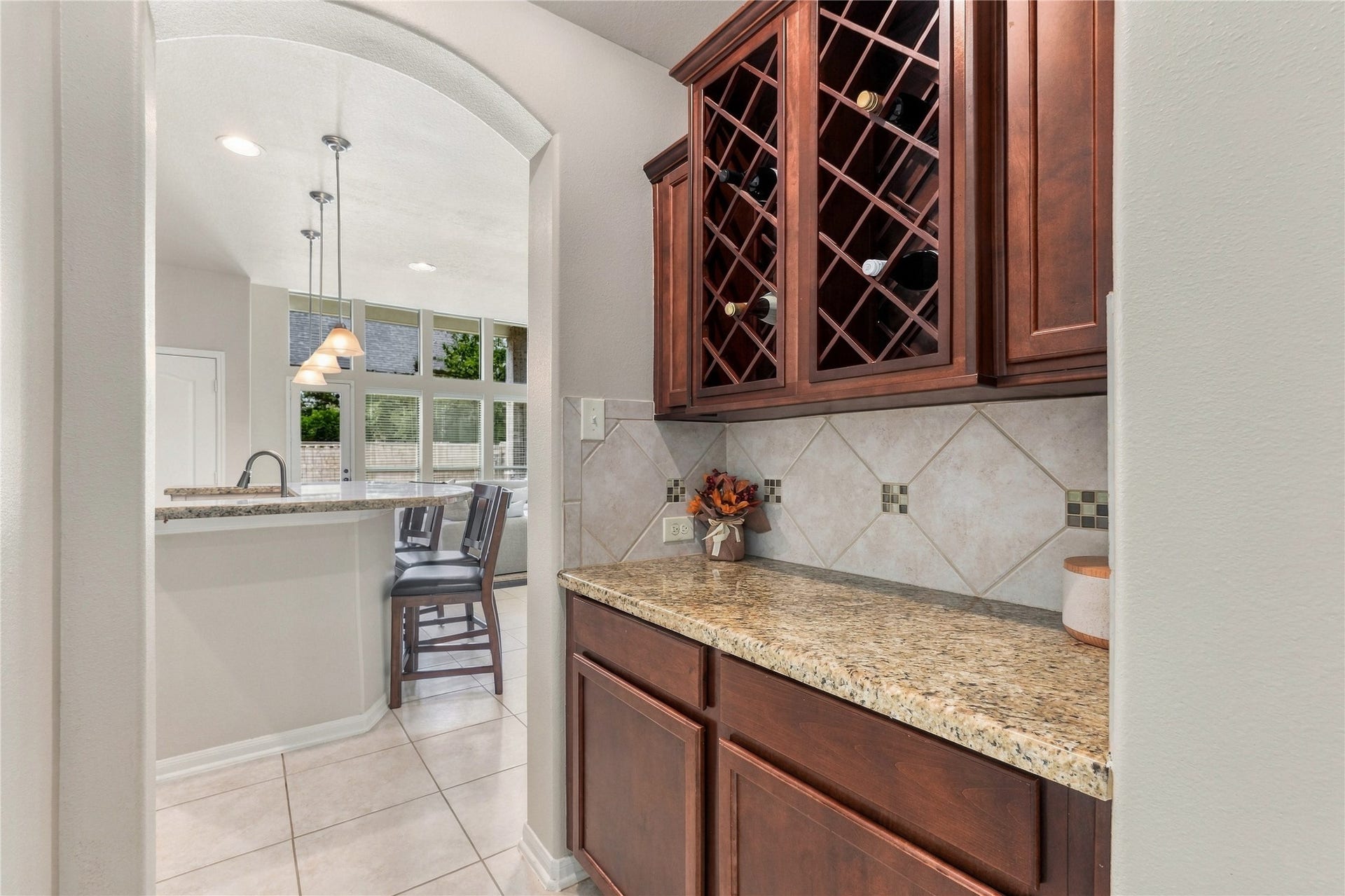20815 S Blue Hyacinth Drive, Cypress, TX 77433 Dont miss the built-in wine storage tucked into the cabinetrya fun little detail that adds personality and makes entertaining even easier.
