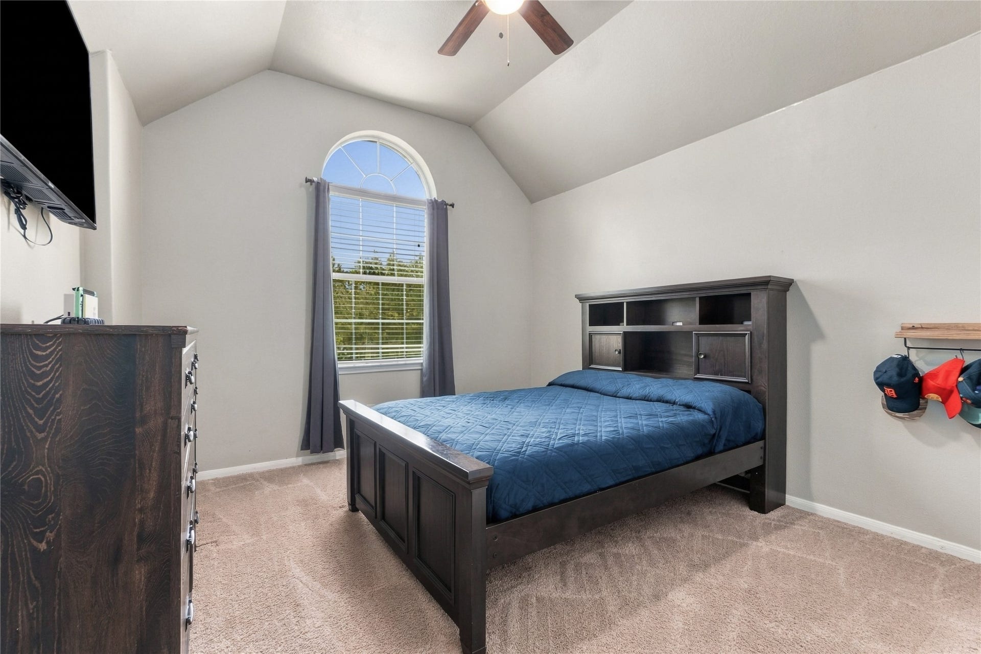 20815 S Blue Hyacinth Drive, Cypress, TX 77433 A vaulted ceiling gives this upstairs bedroom an airy feel and adds architectural character.