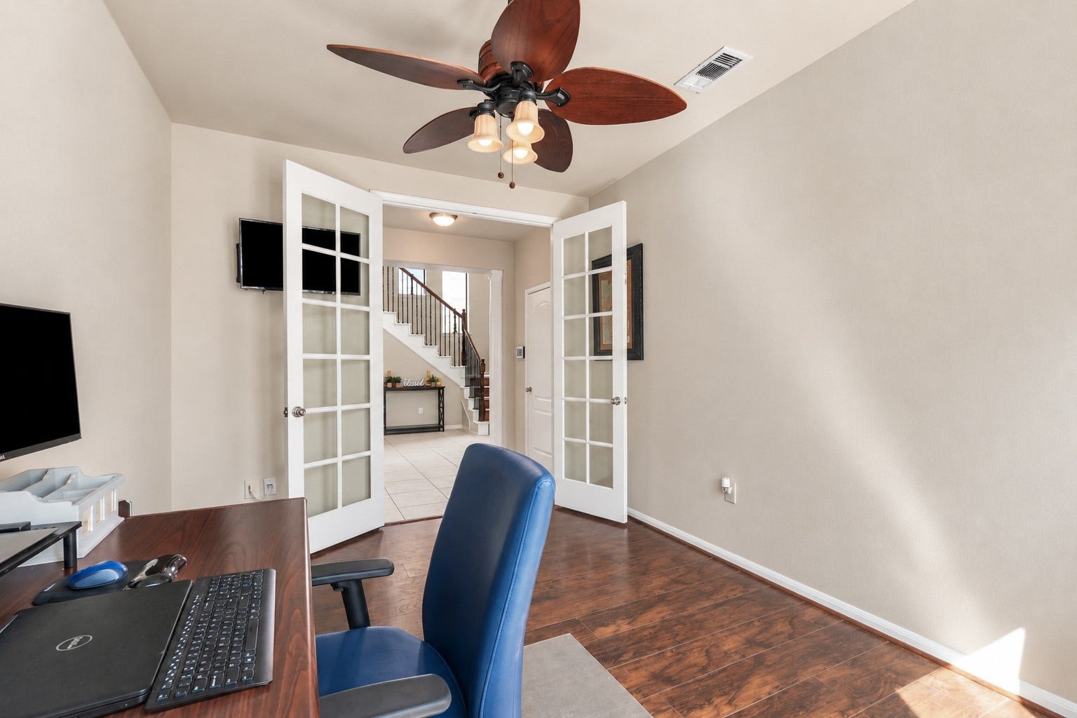 20815 S Blue Hyacinth Drive, Cypress, TX 77433 Just off the entry, French doors open to a dedicated home office that keeps work tucked away while still feeling connected to the rest of the home.