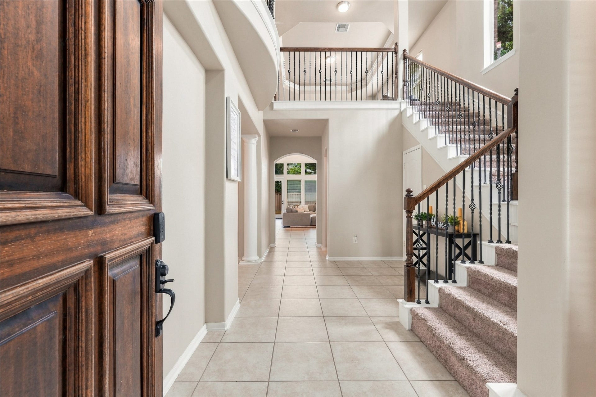 20815 S Blue Hyacinth Drive, Cypress, TX 77433 The moment you step inside, the two-story foyer opens up beautifully with tall ceilings, warm wood flooring, and an impressive staircase leading to the second floor.