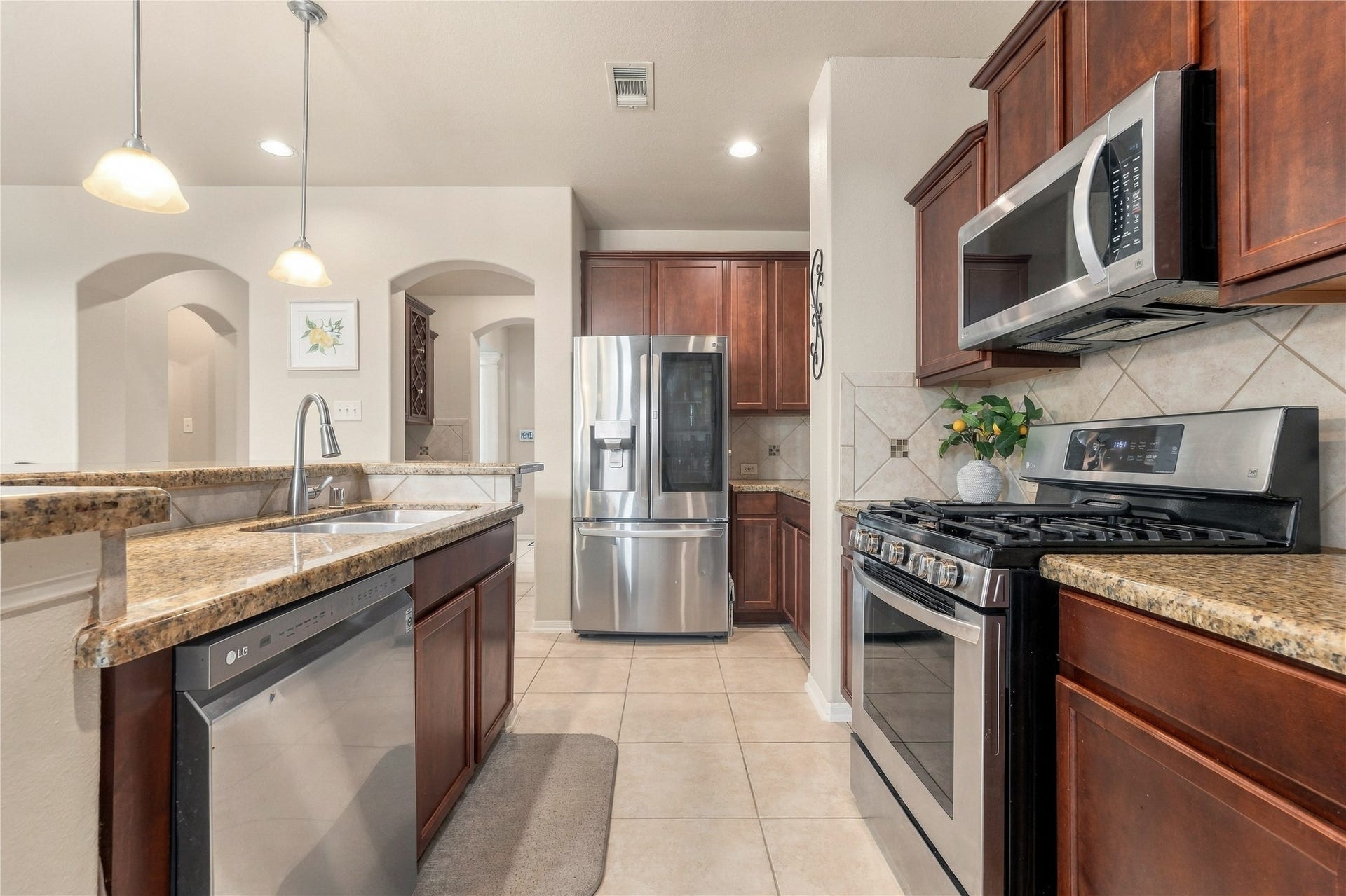 20815 S Blue Hyacinth Drive, Cypress, TX 77433 Theres no shortage of workspace here, with long stretches of granite counters, abundant cabinetry, and stainless appliances all within easy reach.