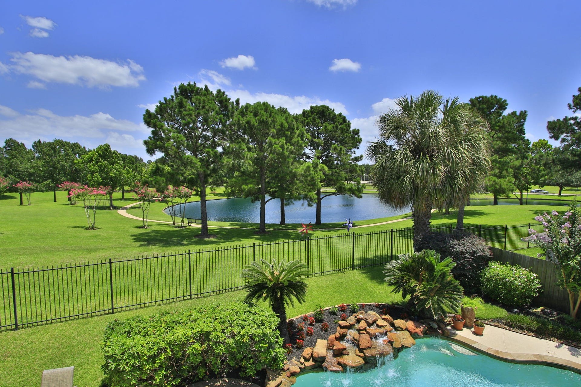 17331 Fairgrove Park Drive, Houston, TX 77095 Serene views of lush greenery and a tranquil pond create a picturesque backdrop for your home.