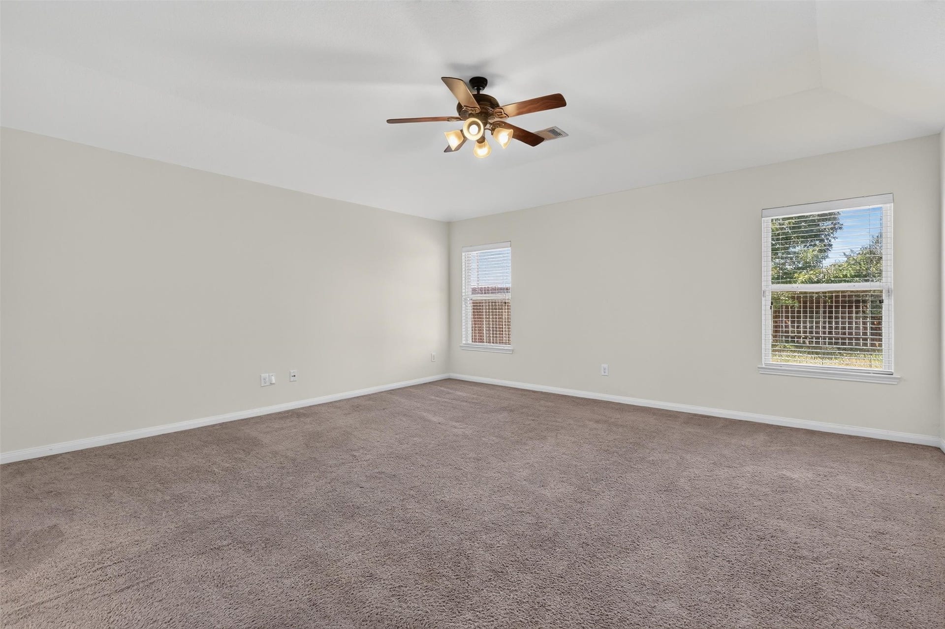 22907 Gentle Shadow Drive, Hockley, TX 77447 Unwind in this inviting bedroom, where two windows welcome natural light and neutral tones create a soothing backdrop for your personal style. Soft carpeting and a ceiling fan add everyday comfort, while the generous layout offers flexibility for bedroom furnishings and a cozy reading nook. An appealing retreat for slow mornings and restful evenings.