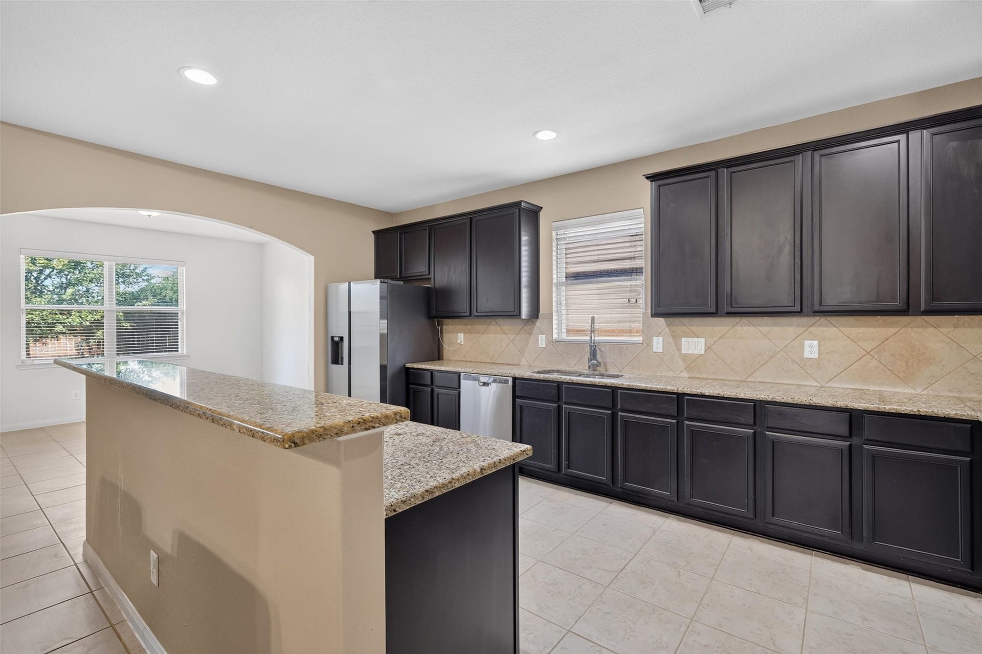 22907 Gentle Shadow Drive, Hockley, TX 77447 A kitchen window welcomes natural light