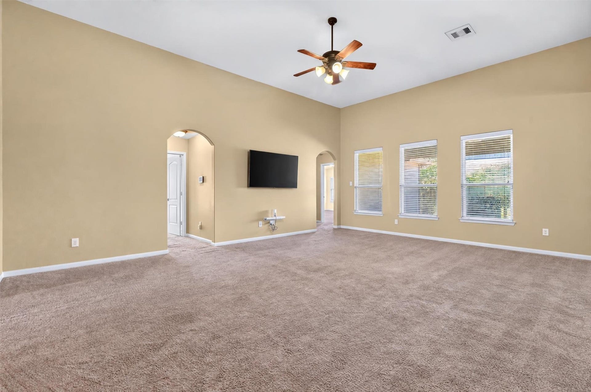 22907 Gentle Shadow Drive, Hockley, TX 77447 Living room with three windows
